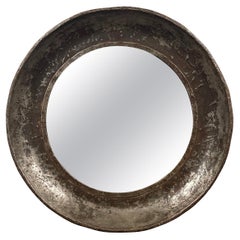 Grand miroir industriel rond encadré d'acier massif