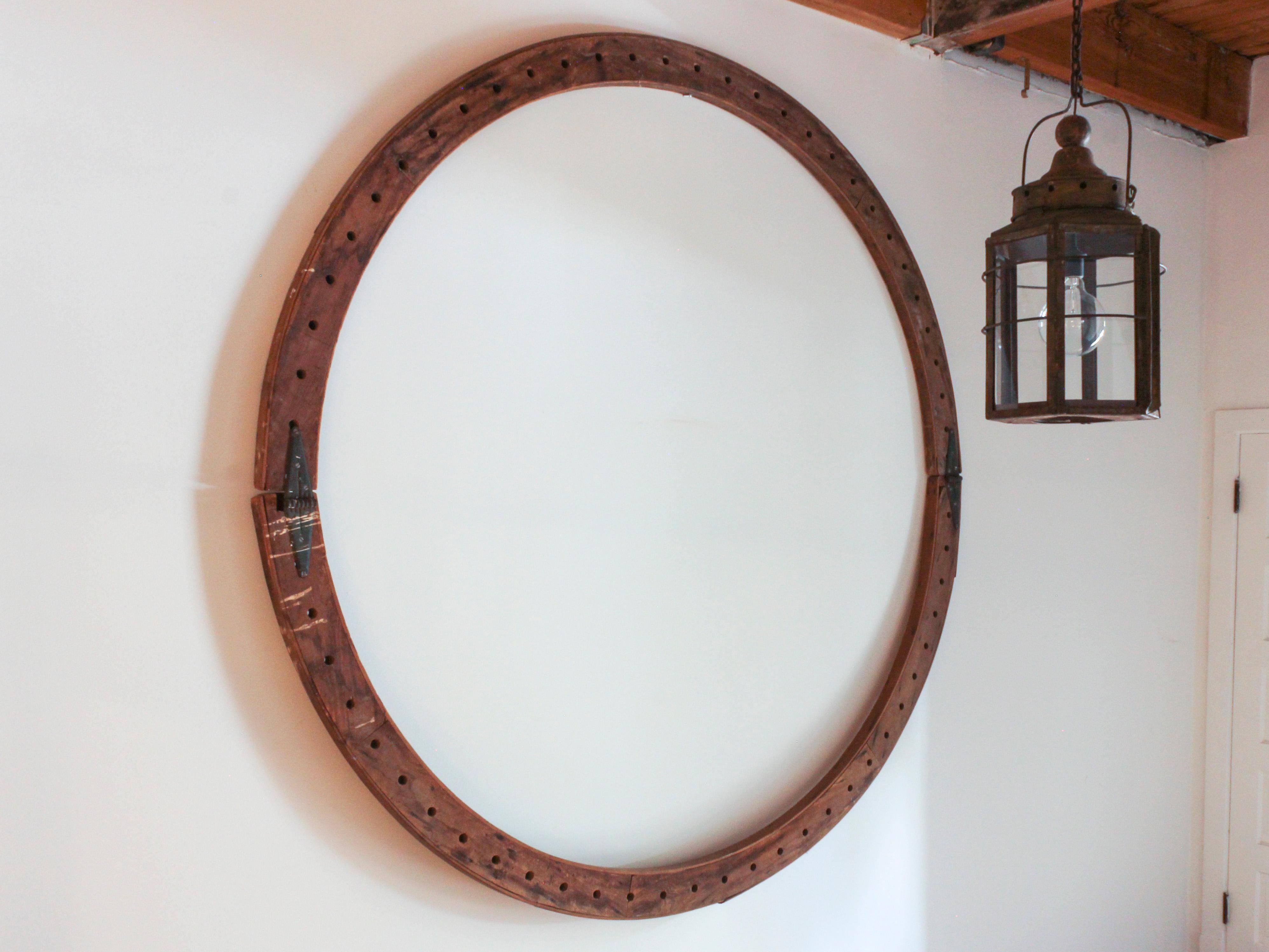 Massive rustic oak circle with hinges, American c. 1910. Architectural salvage, likely used as the top of a wooden vat/barrel. Wood: 1.75