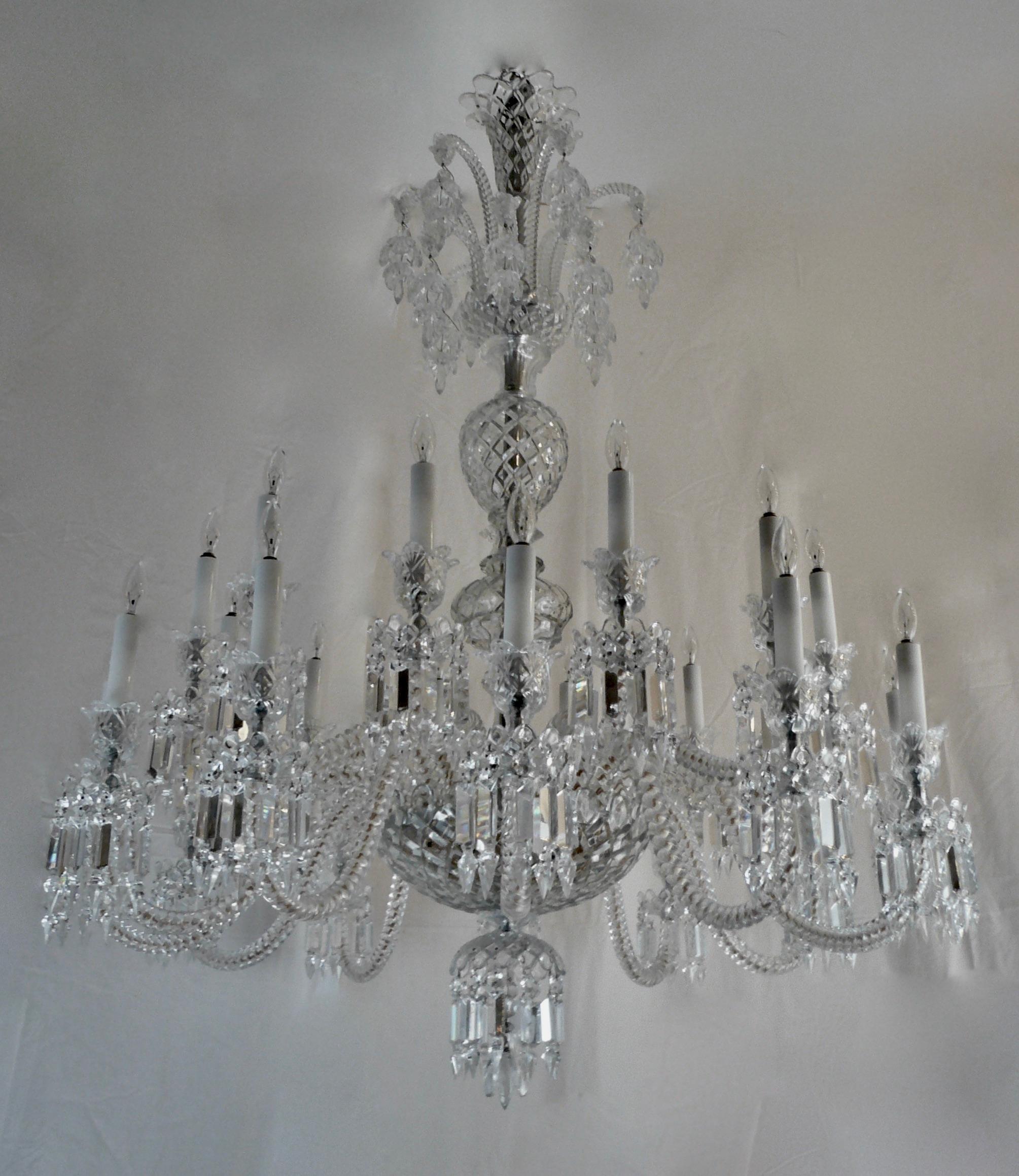 This Impressive chandelier by the renown maker Baccarat features two tiers of arms, baluster form stem, and a corona with hanging crystal fuchsia blossoms.
This chandelier is in excellent condition, and easily disassembles for shipping.