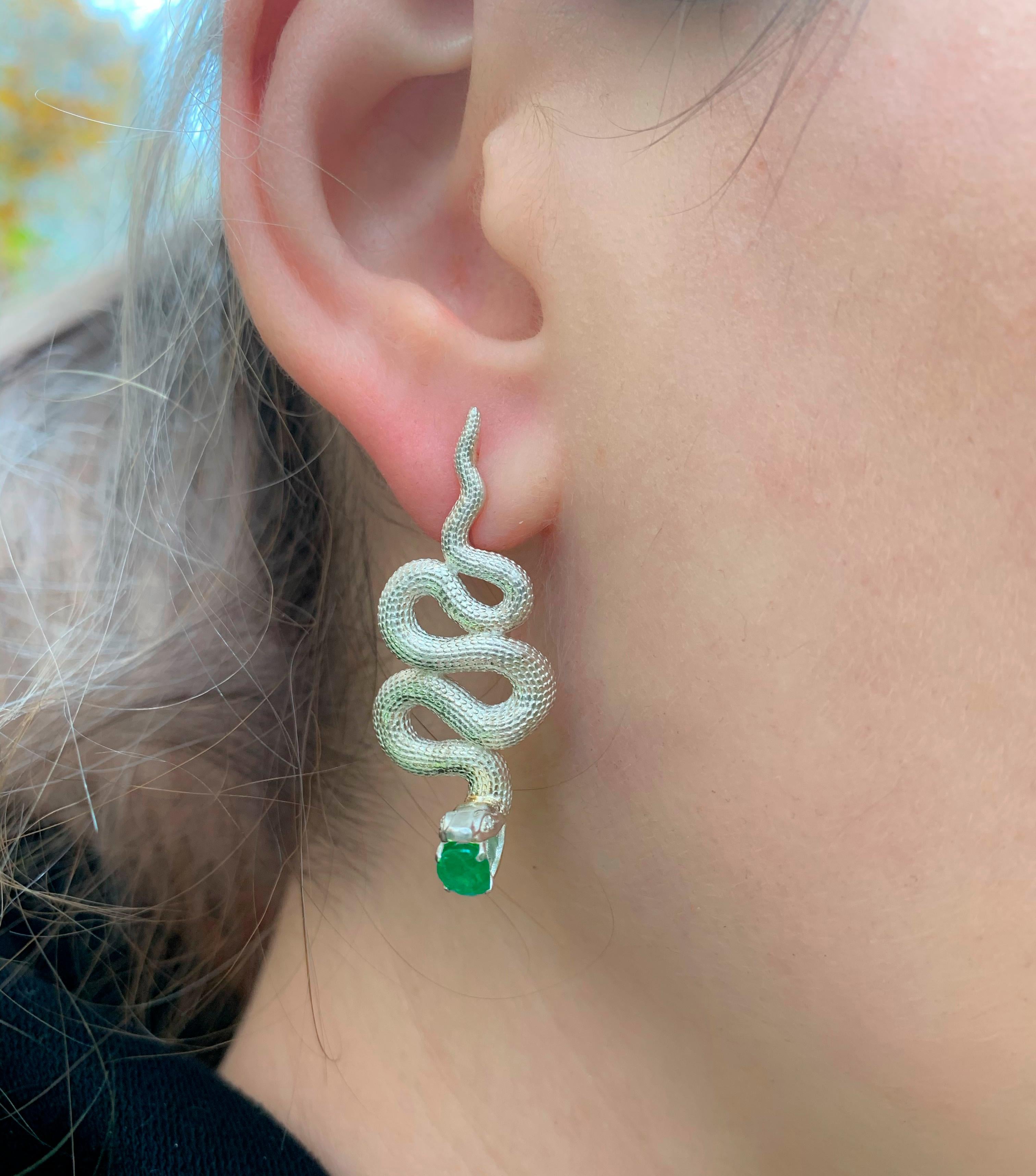 Massive snake earrings. 
Genuine emerald and diamond earrings. Two metal earrings: yellow gold and silver. Serpent Earrings for Women Large.

Earrings are made with two material: 14 kt yellow gold (1.3 g) - clasp and 925 purity silver - other parts