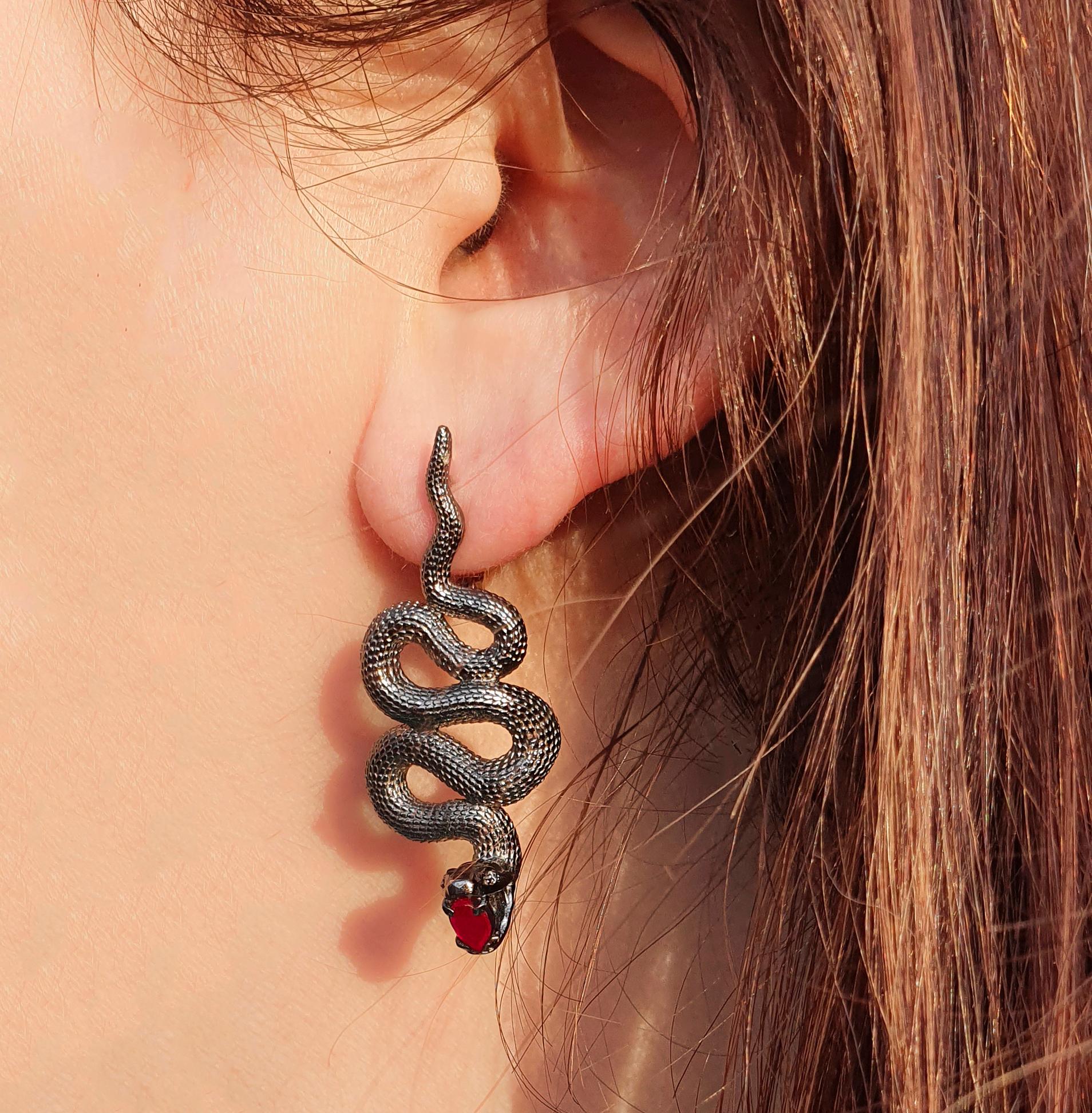 Massive snake earrings. 
Genuine ruby and diamond earrings. Two metal earrings: yellow gold, silver. Black mamba earrings.

Earrings are made with two material: 14 kt yellow gold (1.5 g) - clasp and 925 purity silver - other parts - 12 g.
Total