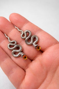 Pendientes de serpiente masiva