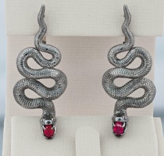 Massive snake earrings with rubies