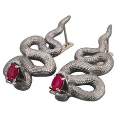 Massive snake earrings with rubies
