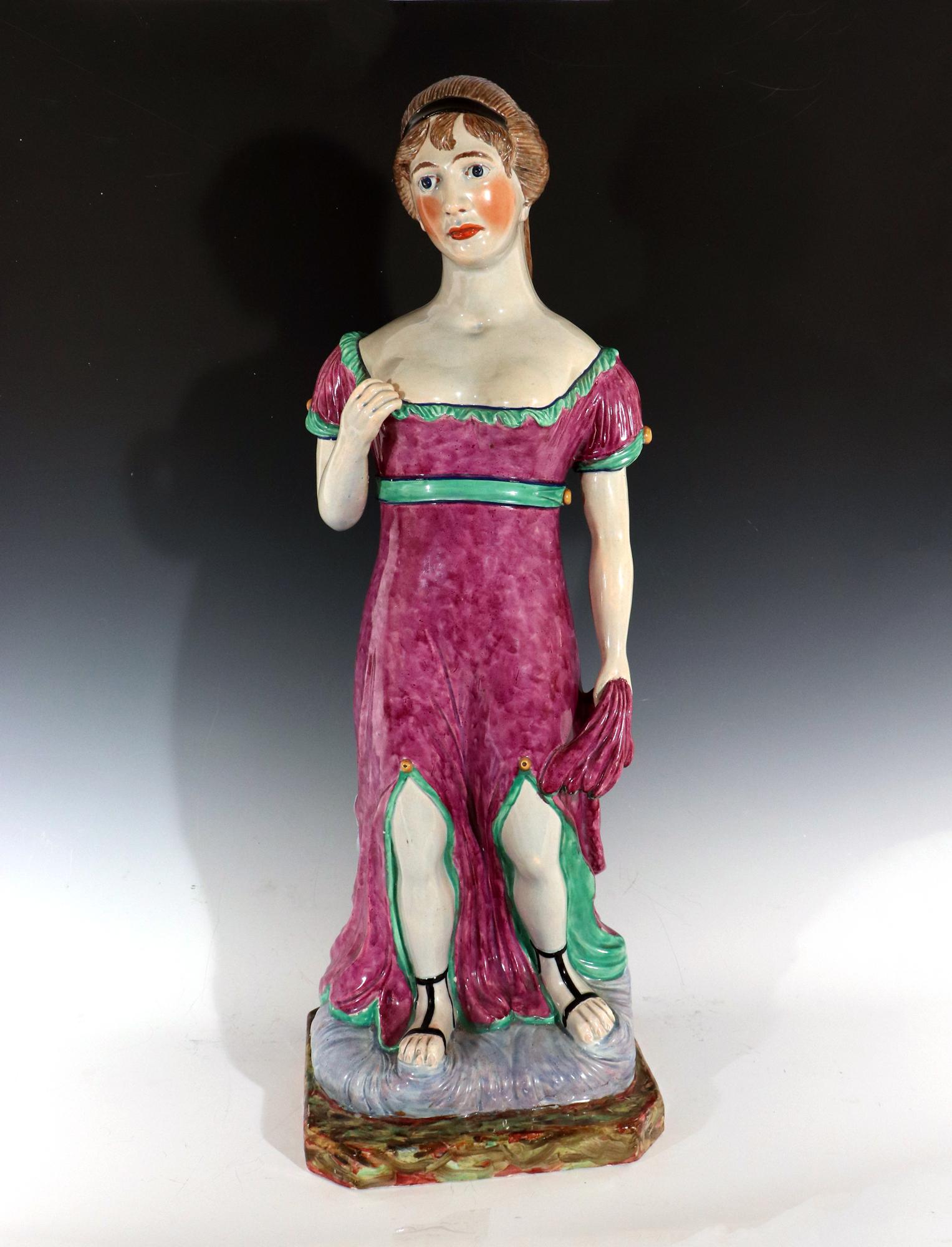 Massive Staffordshire Pearlware Pottery Figure of Venus,
circa 1810

The extremely large figure depicts Venus, Aphrodite of the Classical Greek legend. This model is of great rarity. Venus, is superbly painted, depicted in purple robes with green