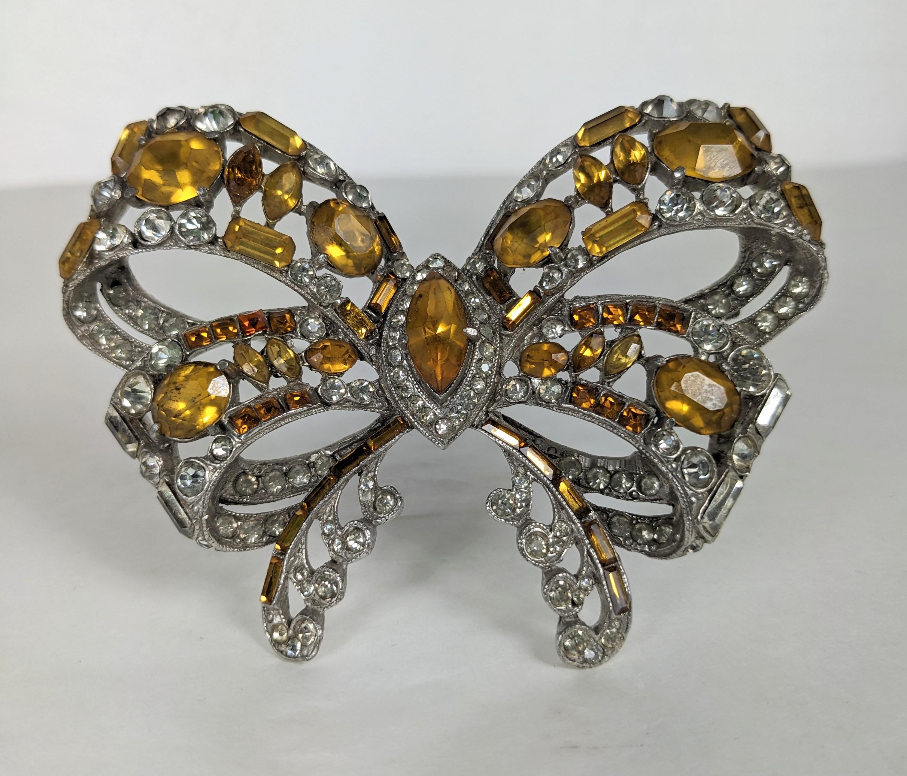 Massive Staret Topaz and Crystal Paste Deco Bow from the 1940's. Huge scale with vari shaped topaz stones in  navette, square, oval and baguette shapes with crystal accents designed in the 18th Century style. 3.5