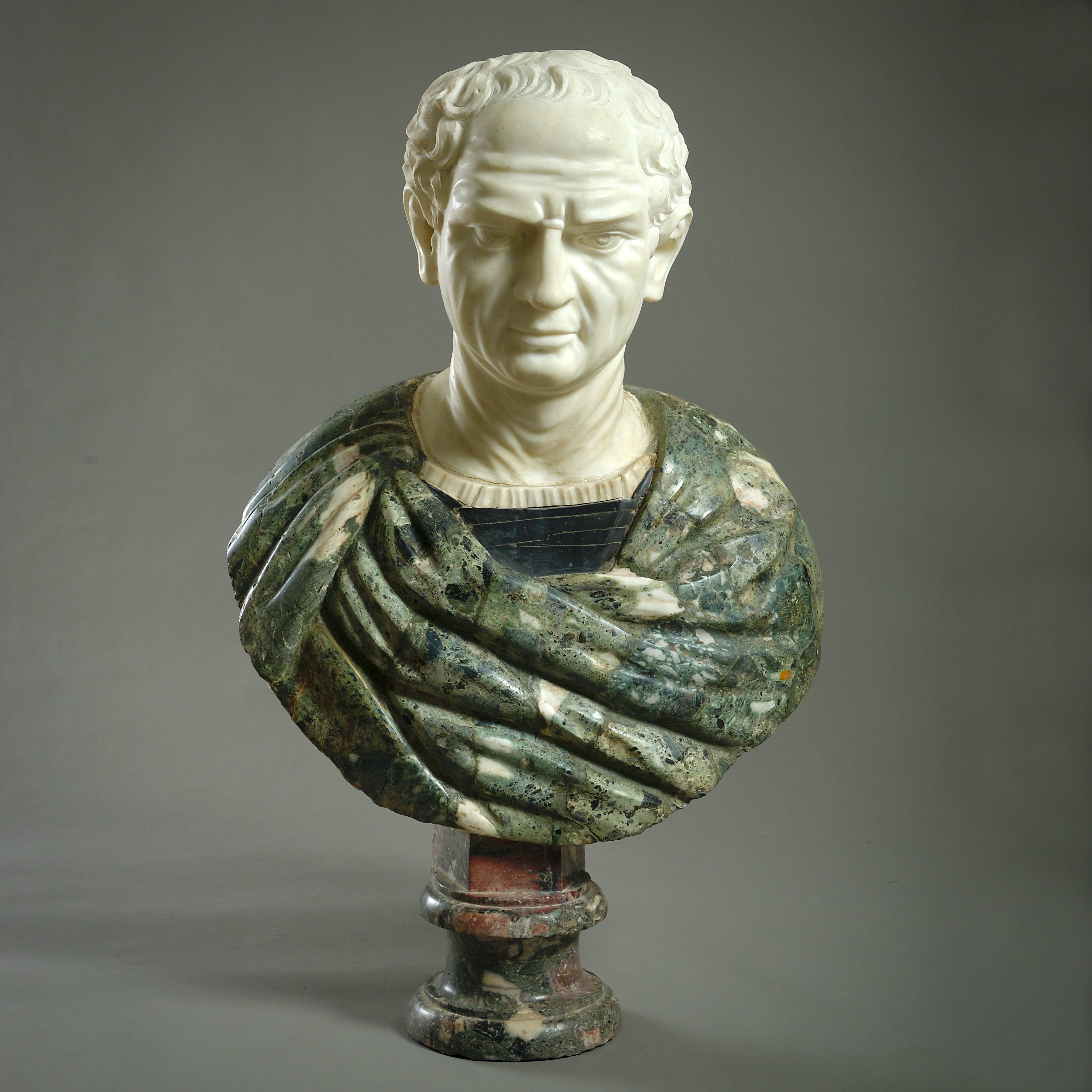 A MASSIVE STATUARY AND POLYCHROME MARBLE BUST OF AN EMPEROR, PROBABLY ROME, LATE 17TH / EARLY 18TH CENTURY.

Incorporating Verde Antico, Nero Belgio and Marmo Africano from ancient sources.