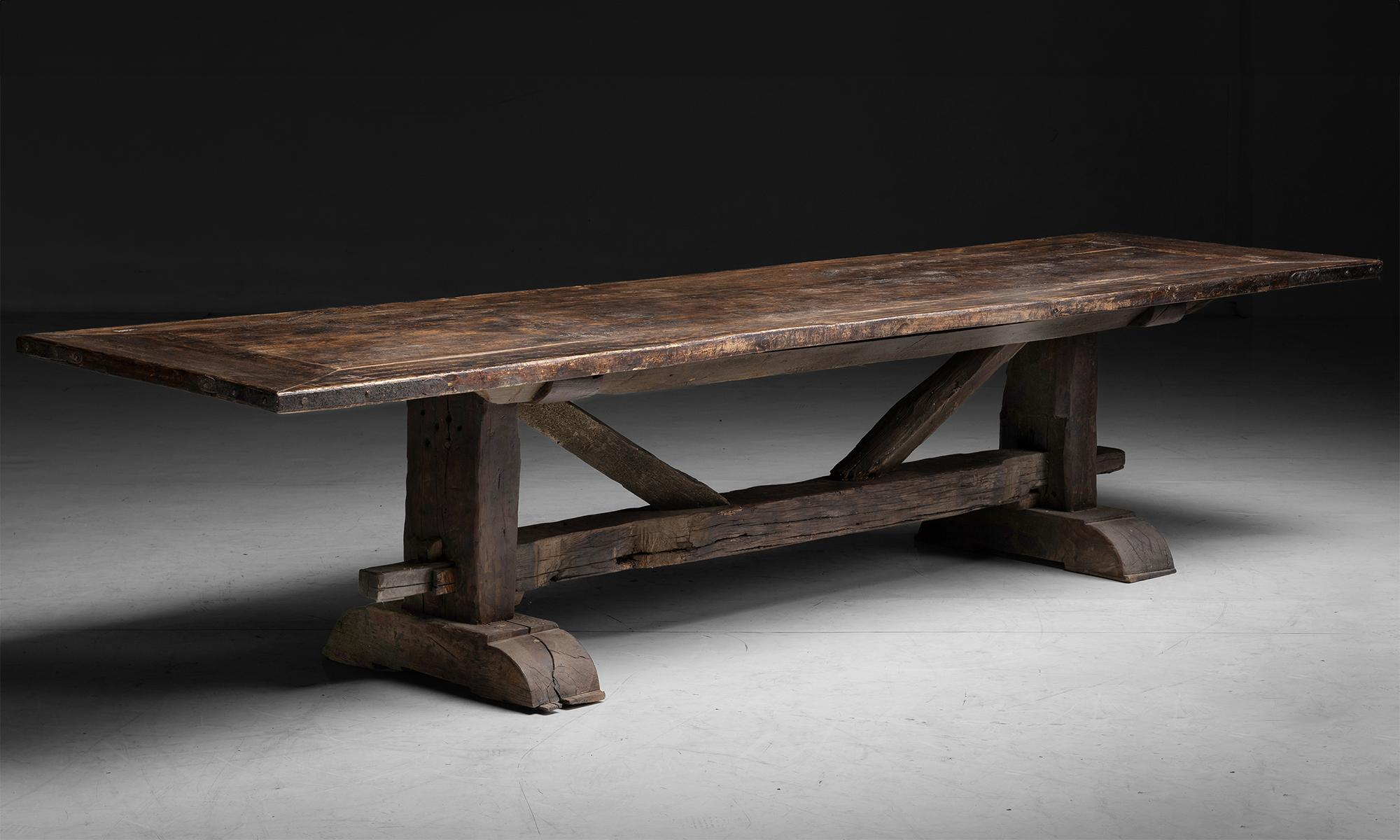 Massive Trestle Dining Table

France circa 1890

Constructed in thick beams of pine, with framed top and iron supports.

130”L x 35”d x 28.75”h

Ref. TABLE1275