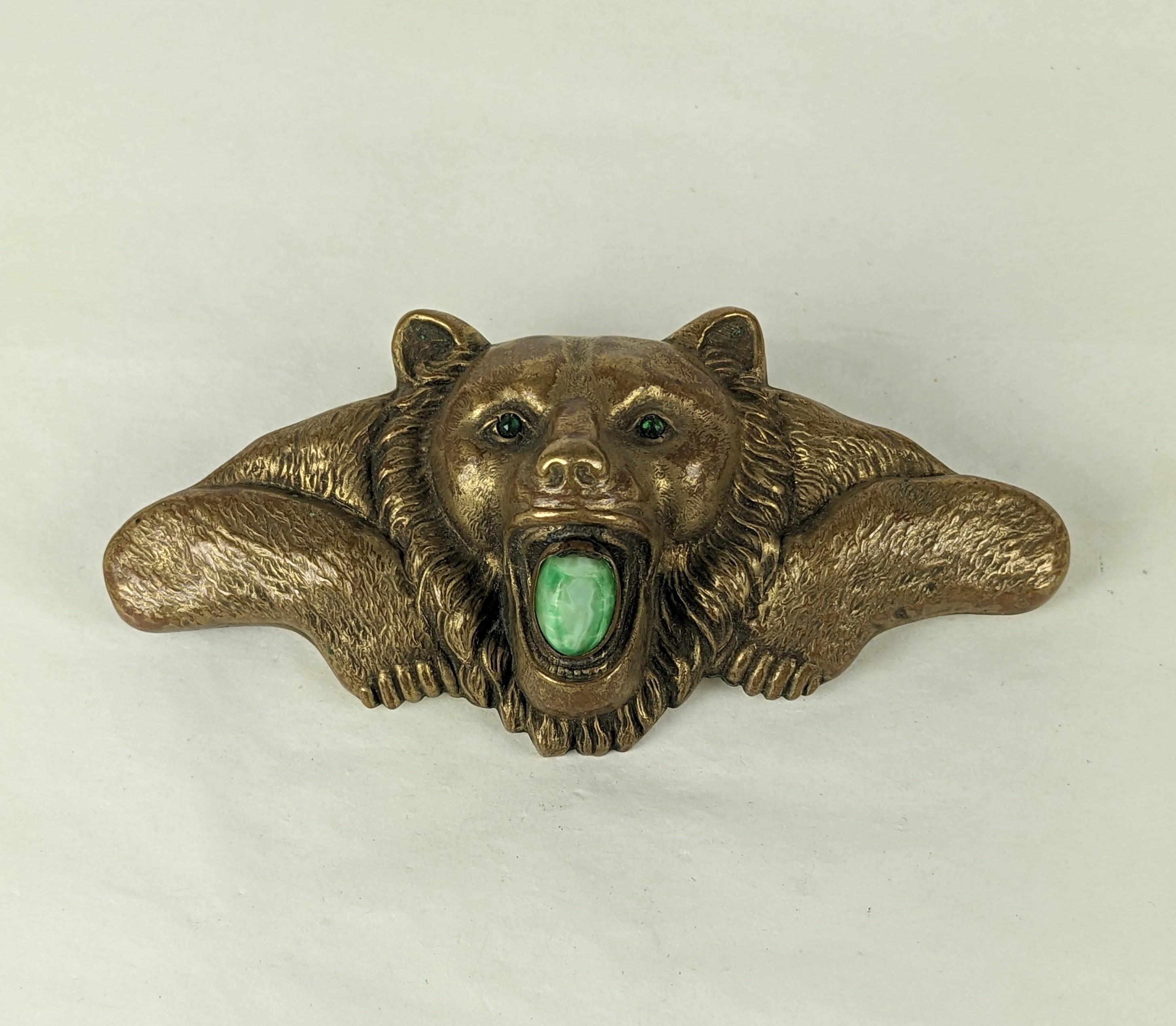 Massive Victorian Bear Cloak Clasp Brooch from the late 1800's. Large and dimensional, with beautiful detailing throughout. The bear has emerald paste eyes and it holds a large faux jade in its mouth (chip). Very unusual and striking size. 1870's.