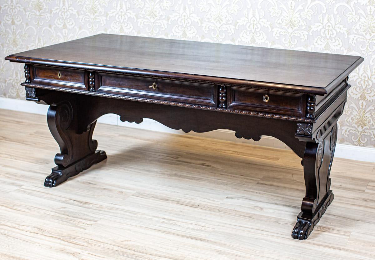 Massive Walnut Center Table from the Early 20th Century in Dark Brown

We present you this big, massive center table from the early 20th century. What deserves the attention are the high craftsmanship of the carved patterns and the striking legs