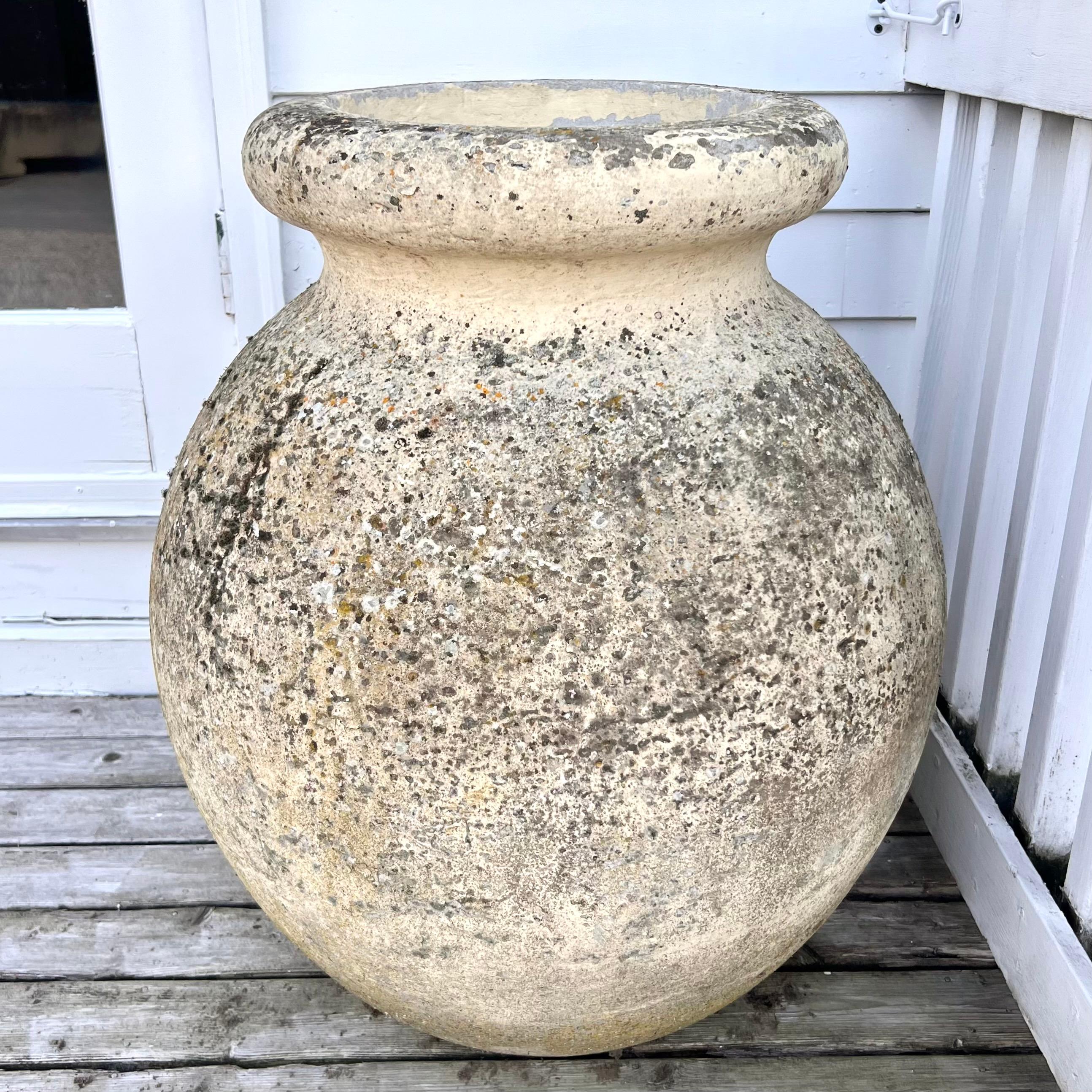 Oversized concrete olive jar planter by Willy Guhl with great patina and prominent presence. Simple and elegant design perfect for any garden or patio. Gorgeous speckled patina and excellent vintage condition. Multiple available in this size with
