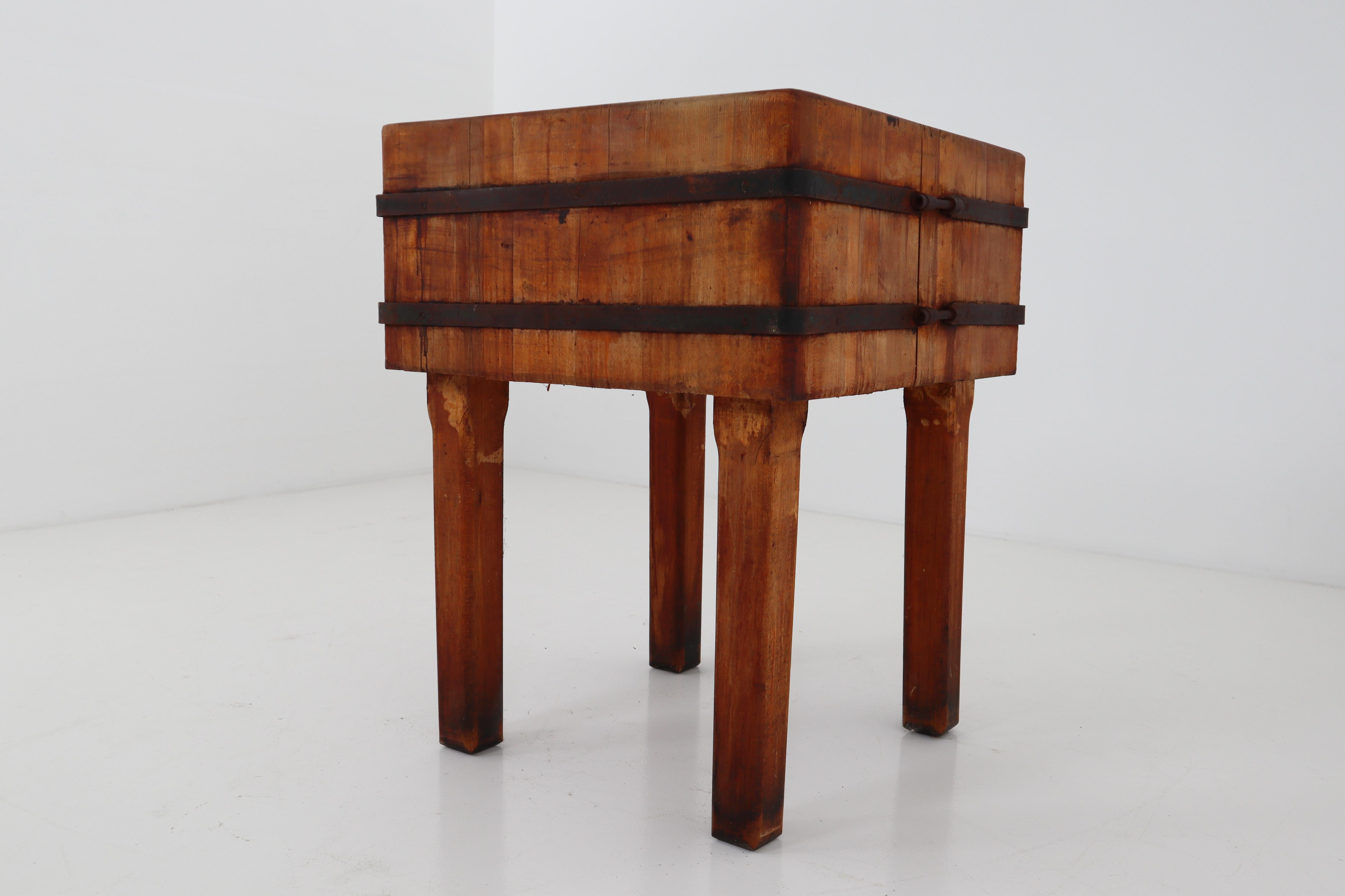 An incredible, vintage, wood butcher-block table. Hailing from a Vienna market opening in the 1930s, an unbelievable piece, beautifully worn from years of use. The top surface revealing great craftsmanship in its intricate dovetail joinery. The