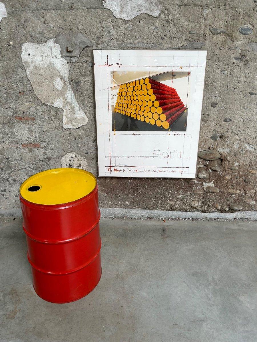 CHRISTO Mastaba Project for the Kunstverein in Koln 1986 Screenprint Signed and numbered 164/200 With a red and yellow metal barrel from the installation reproduced on the print Screenprint 80 x 60 cm Barrel 60 cm high