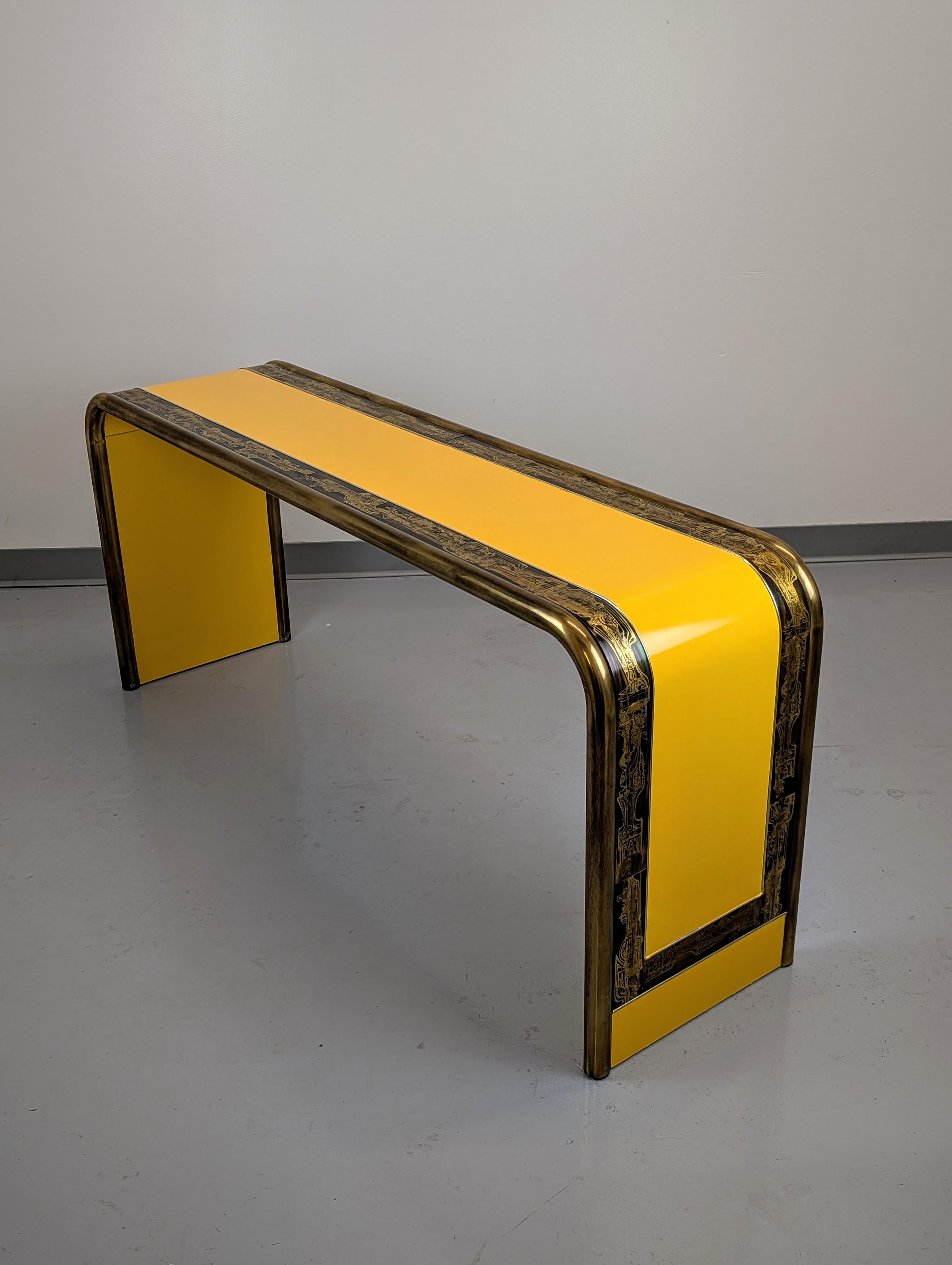 Lacquer yellow and brass details waterfall Console by Bernhard Rohne for Mastercraft. Model 1609 sofa table features acid etched brass panels by BernHard Rohne. Features Mastercraft signature antique brass plating. 