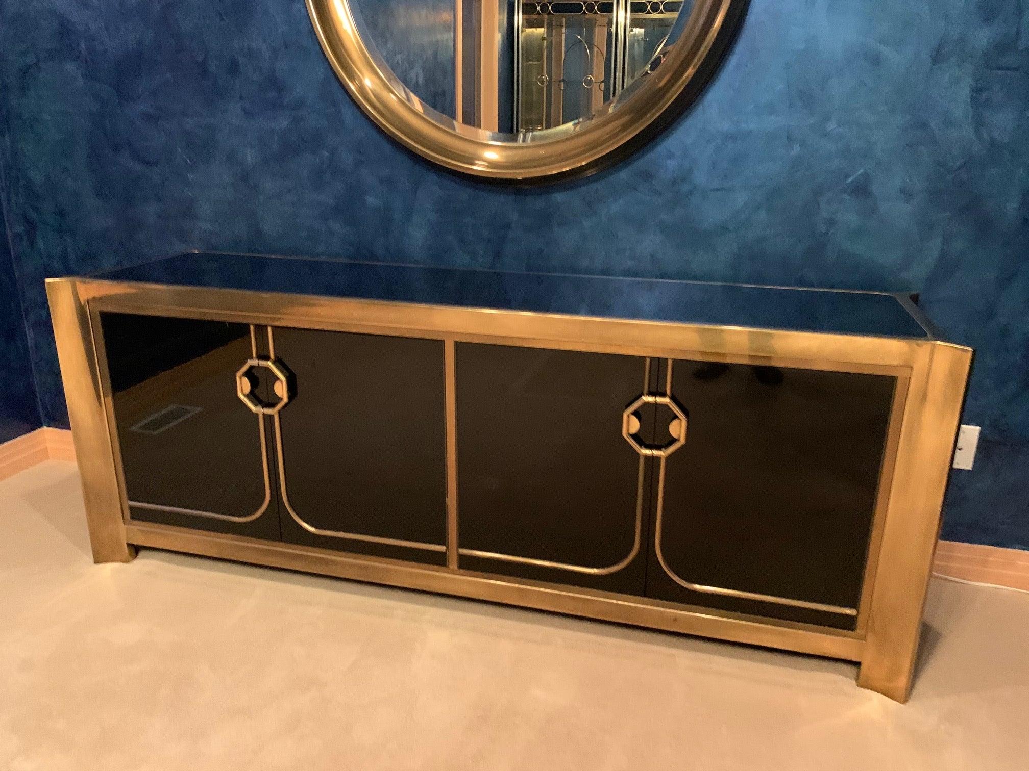 This glamorous sideboard is from a particularly ultra deluxe collection by Mastercraft Furniture Company designed by William Doezema where the quality of materials and finishes were executed to an exceptionally high standard. Shaped solid brass