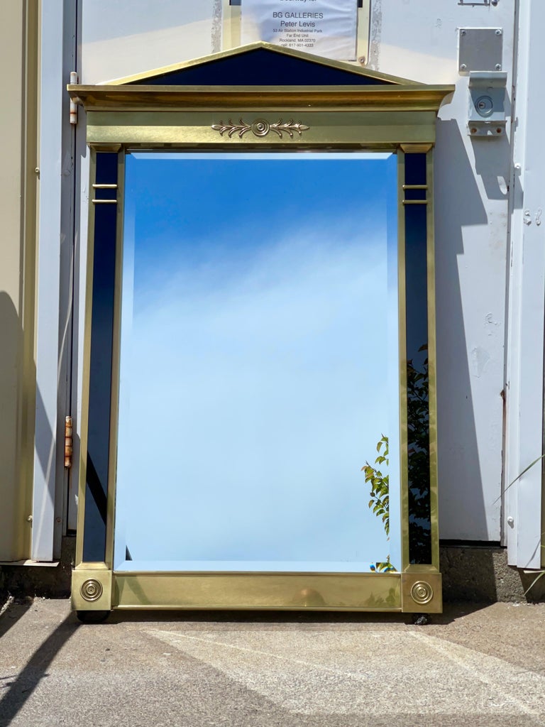 Mastercraft furniture model 241 Empire style framed beveled mirror in antiqued brass with black glass embellishments.
See original page from Mastercraft catalog. Designed by William Doezema and produced in the mid-1970’s. Particularly luxurious and