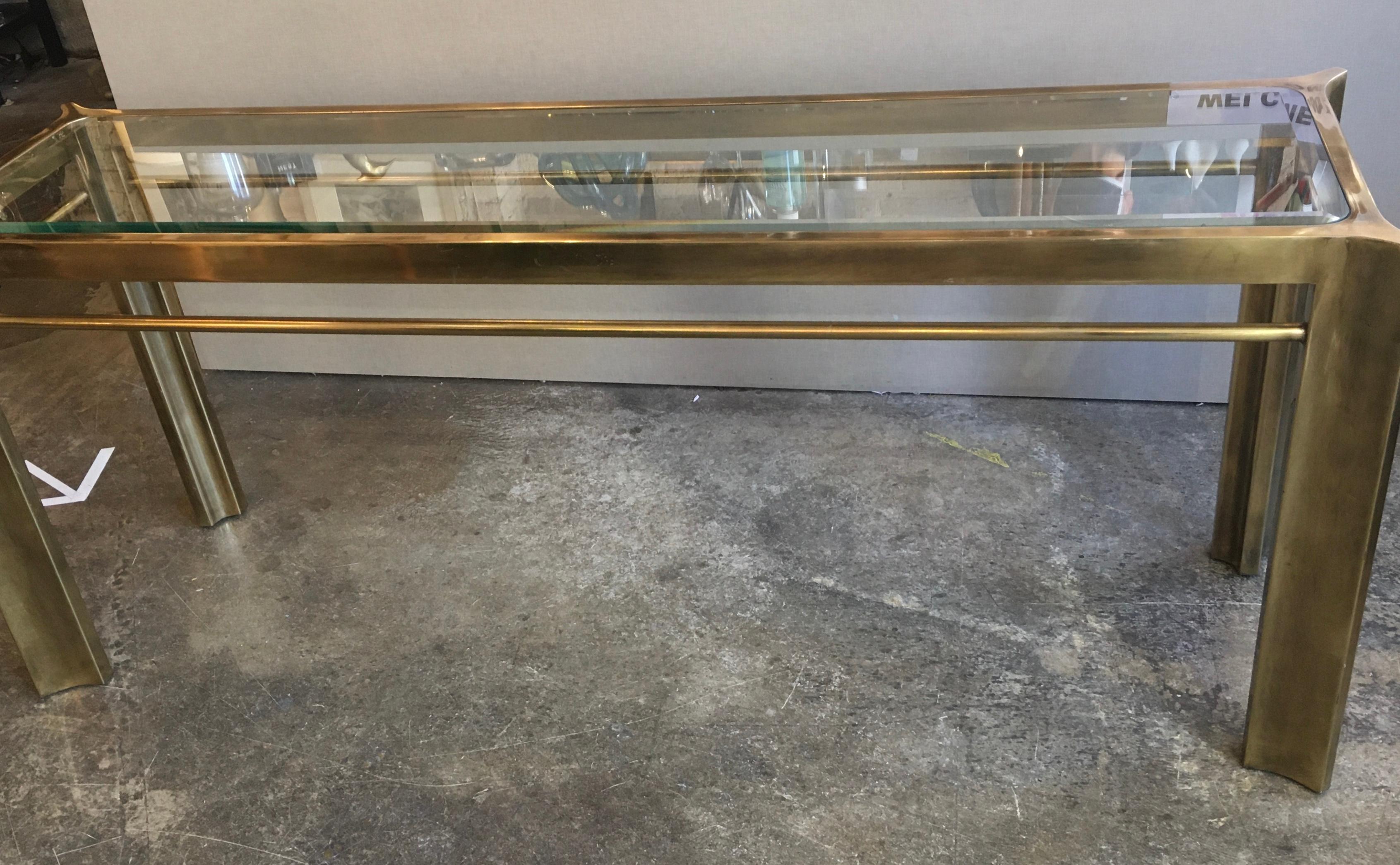 Mastercraft brass and glass console table.