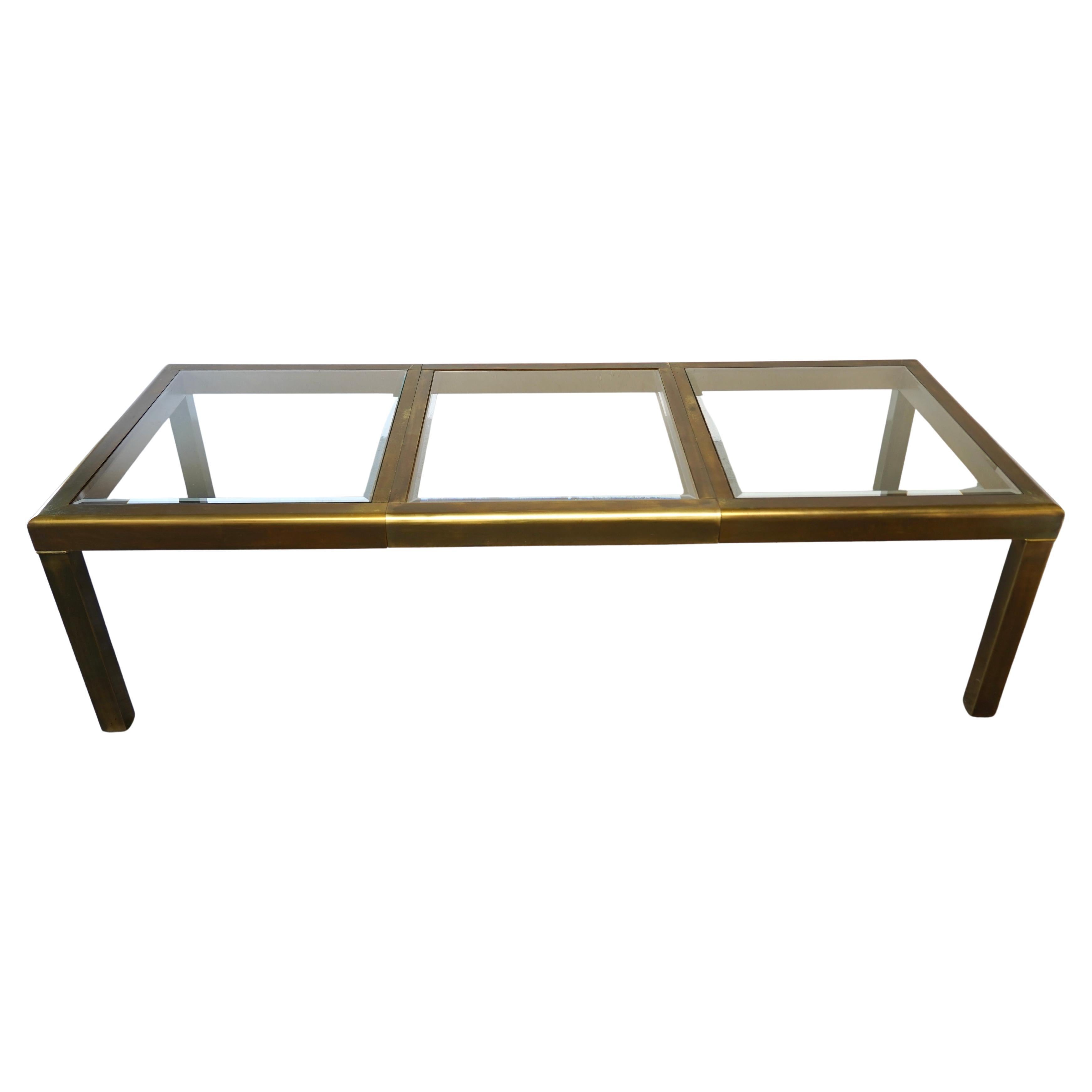 Mesa de comedor extensible Mastercraft de latón y cristal