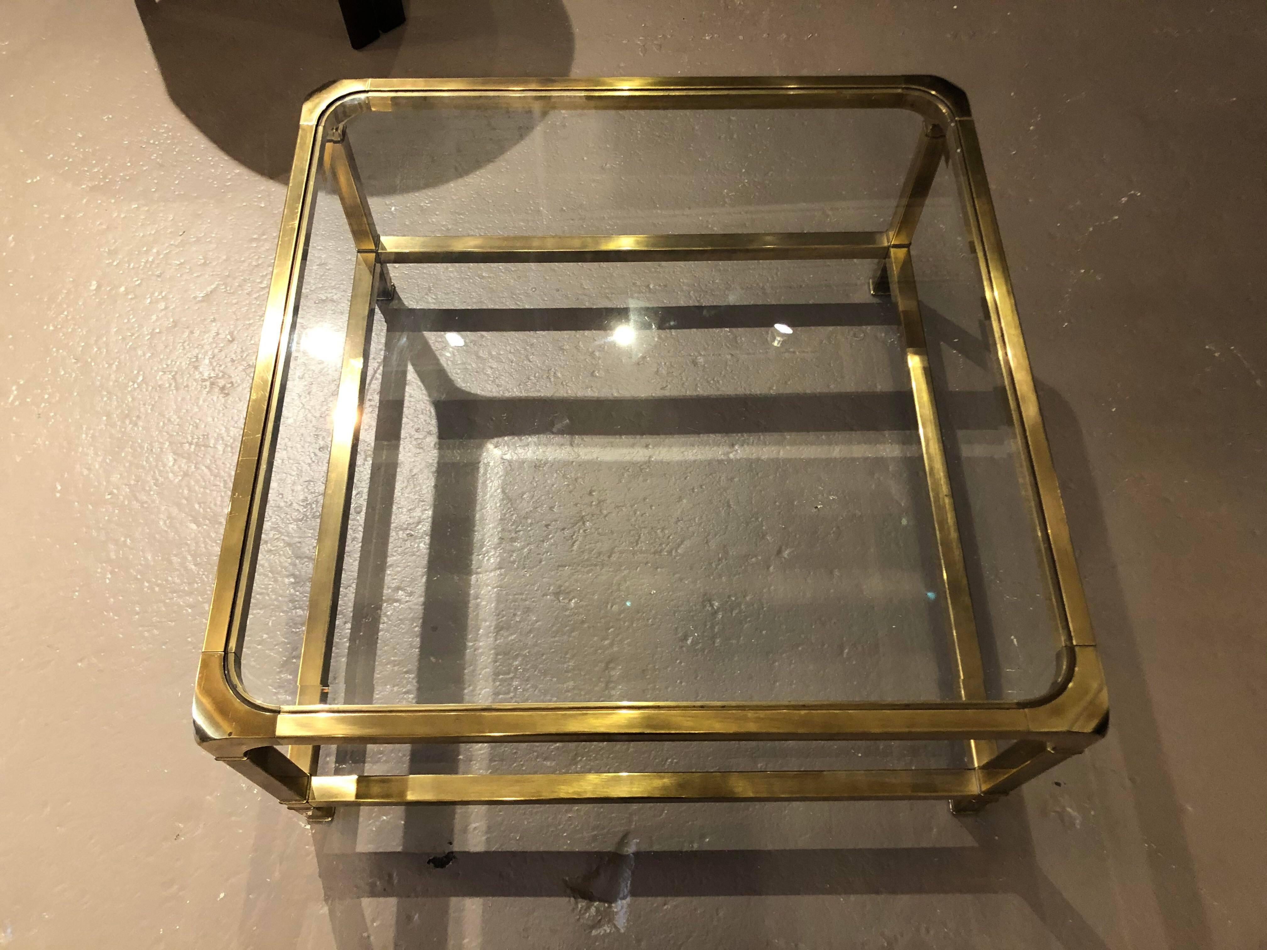 Gorgeous and great condition brass and glass coffee table! I loved the rounded edge (child friendly) and still so chic. I actually have this table in my own living room.

Dimensions: 34
