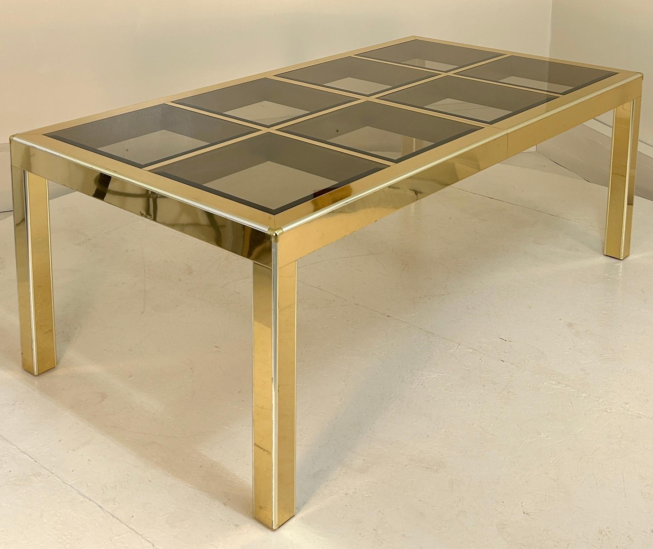 29.5 inches high by 81 inches long by 42.5 wide. Seats 6-8. Parsons form dining table by Mastercraft of Grand Rapids clad in brass sheet with brass edge trim and bevelled glass inserts Glass is tinted This table comes with no leaves although it is