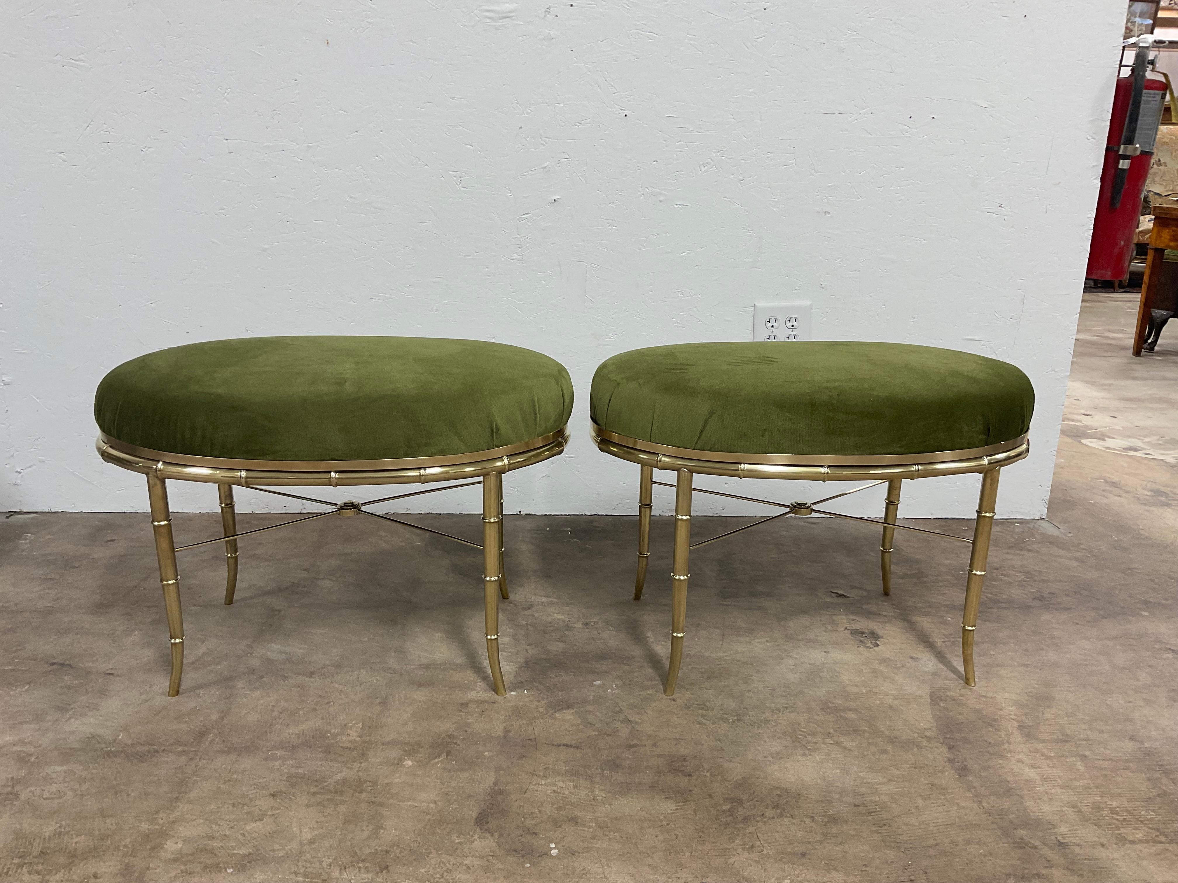 Love this pair of Mastercraft faux bamboo brass  tables/ benches from the 1970s. Originally tables( no glass or mirror included)  the pieces have been converted to a pair of benches. The newly upholstered seats are done in a rich , green performance