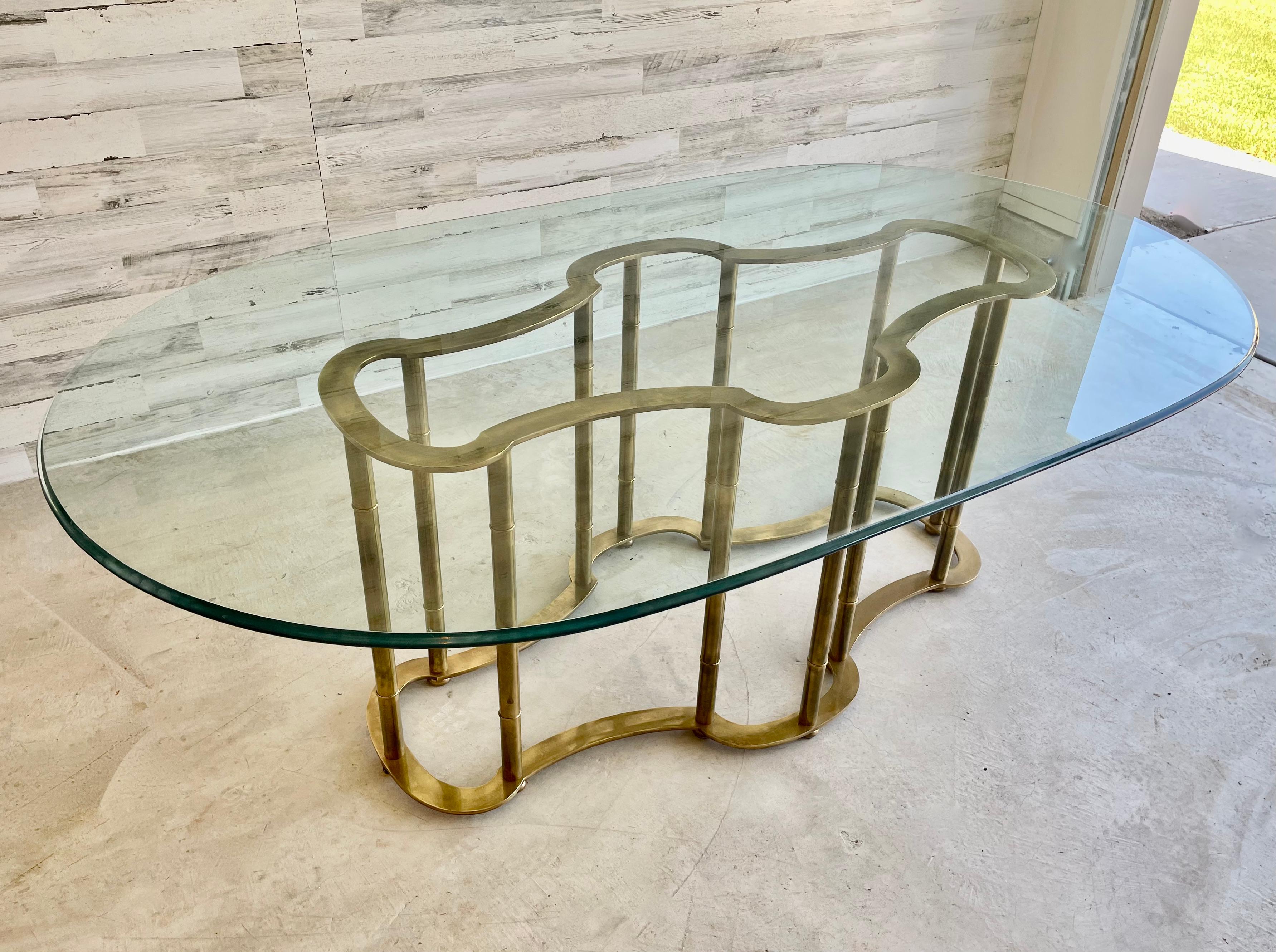 Massive Mastercraft brass base faux bamboo dining table with thick beveled glass top. Original Made in Italy label still attached.
Base measures: 55.25 L x 27.5 D x 28.25 H.
