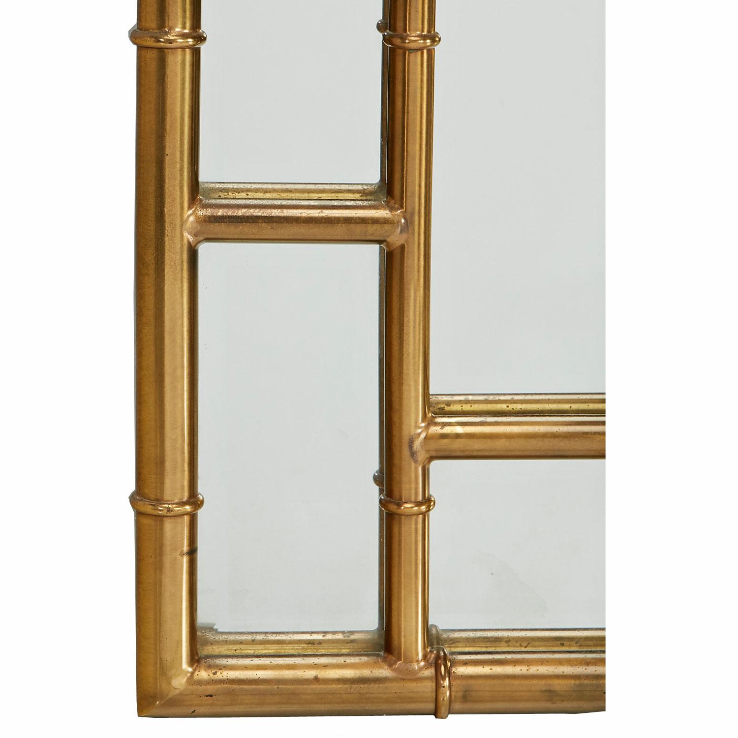 Breathtaking Hollywood Regency brass Mastercraft mirror. The frame is fashioned in the style of bamboo stalks to add an eastern flare. Hollywood Regency and Asian modern meld together beautifully in this stunning and distinct Mastercraft mirror.