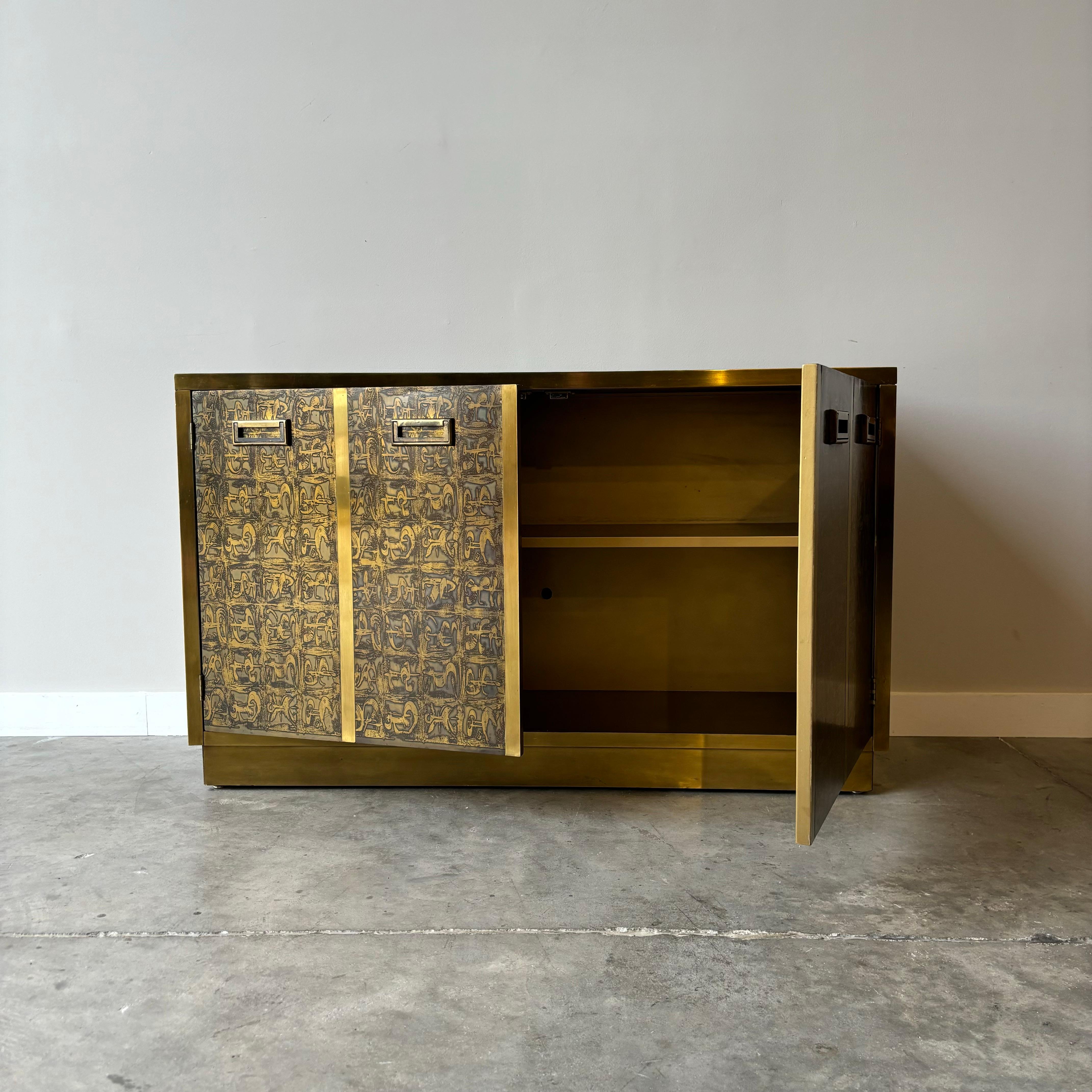 A striking and rare example showing beautifully.  Acid-etched brass with plenty of open storage in a small footprint.  A classic by Mastercraft., Bernard Rohne.
