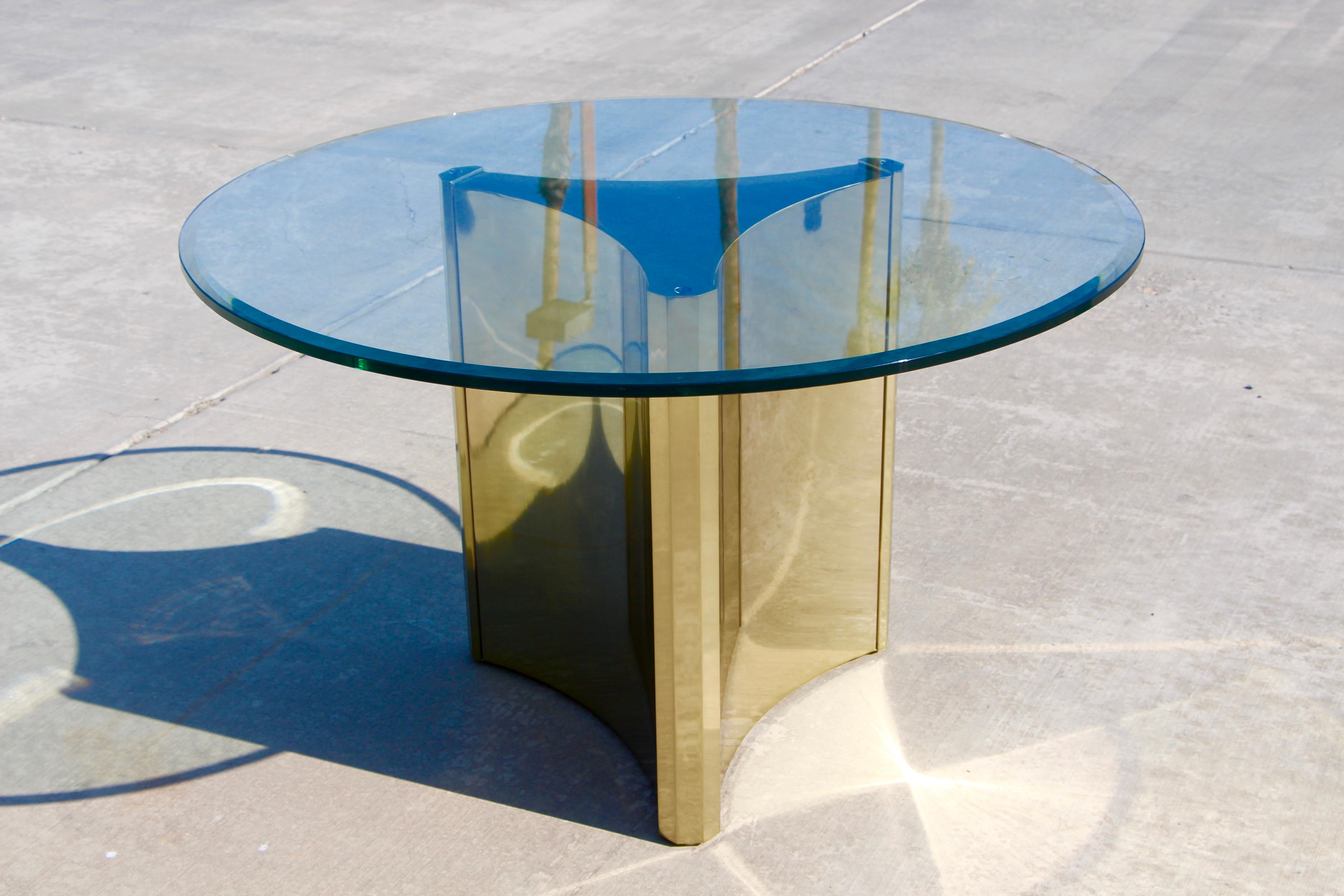 A nice example of a trefoil base brass plated Mastercraft table. Comes with a 48