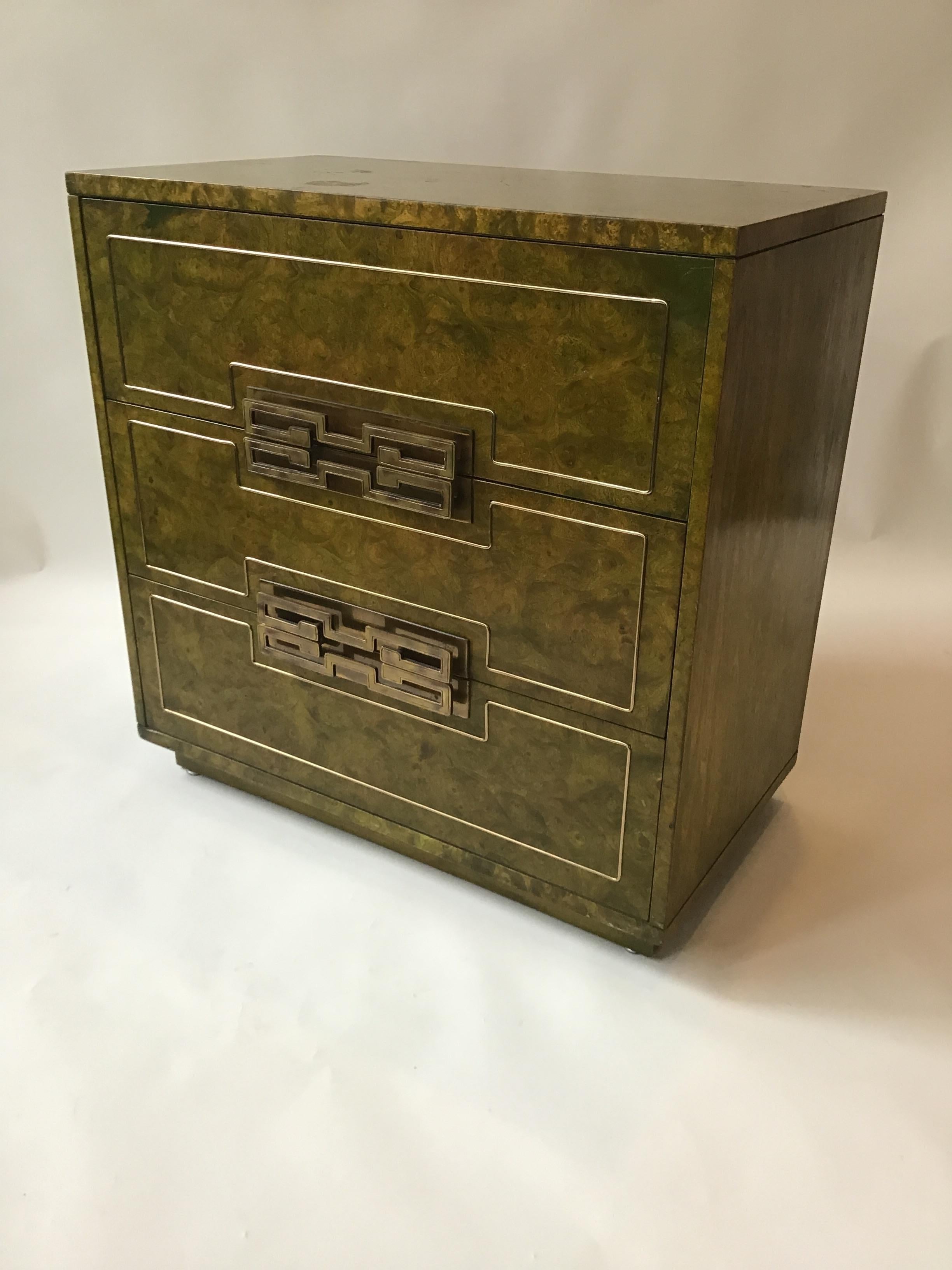 Mastercraft burl wood chest in green tint with brass hardware.