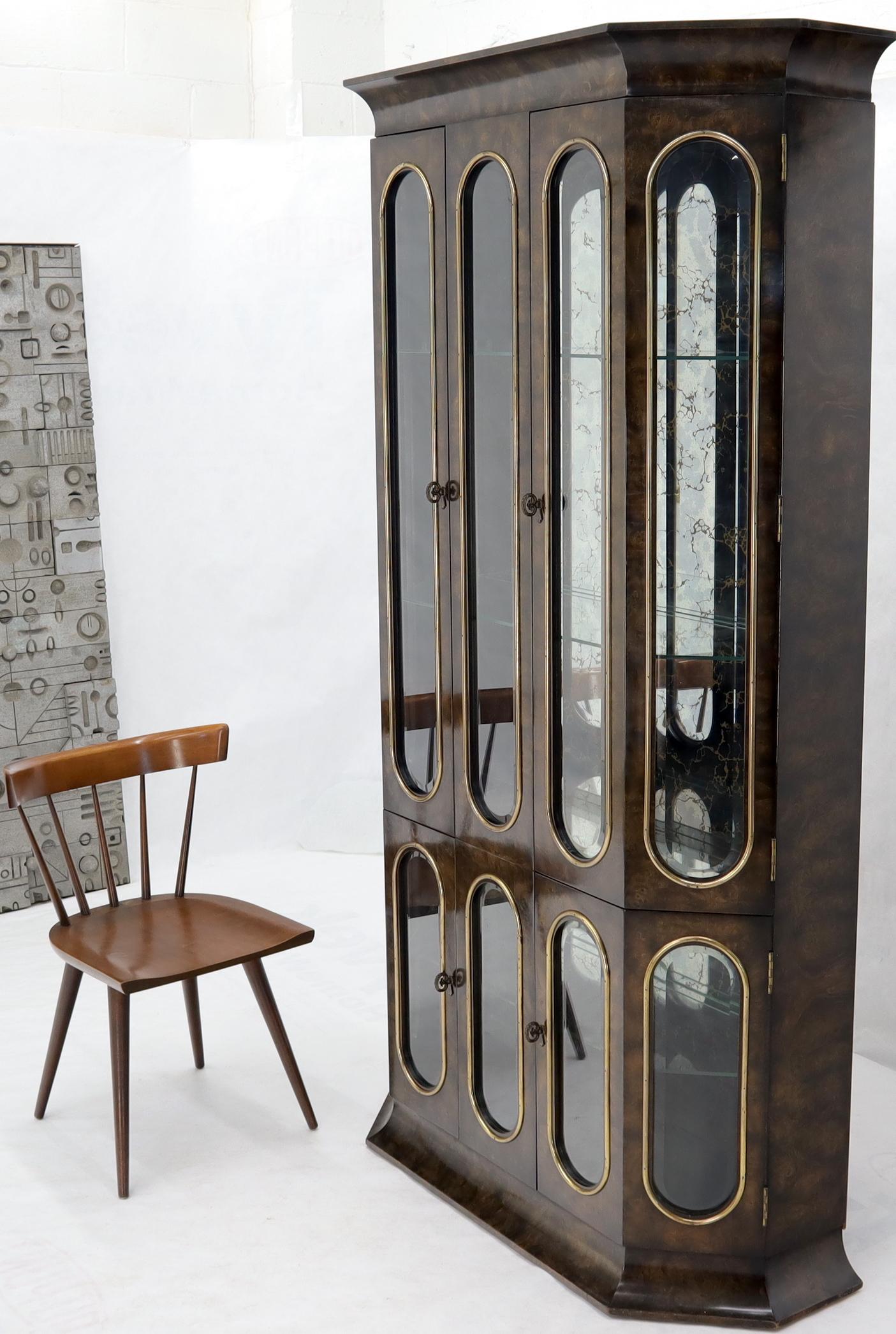 Mid-Century Modern tall tower shape breakfront by
Mastercraft. Brass trim, burl wood, beveled glass, and other high quality craftsmanship details. 
 