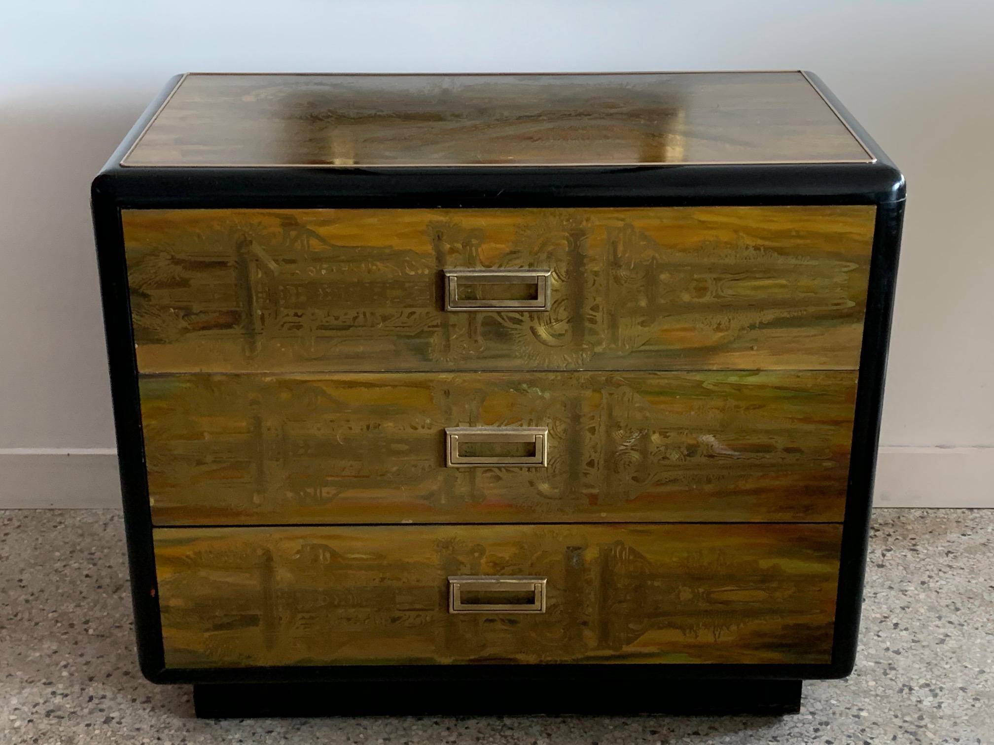 A great 1960s three-drawer chest of drawers and matching mirror by Bernhard Rohne for Mastercraft. Acid etched brass and lacquered wood, with rounded corners on the chest. The mirror is not attached.