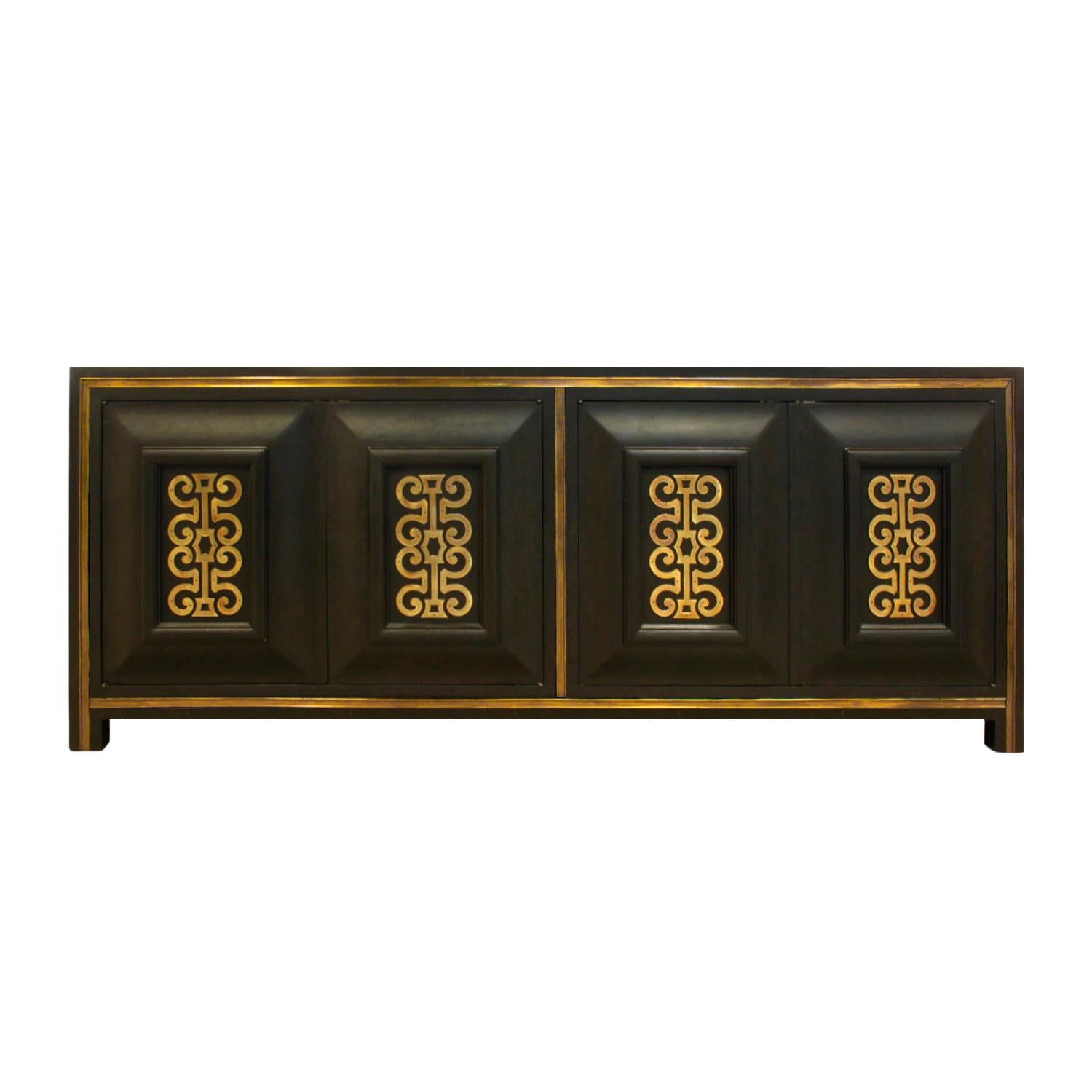 Low credenza in smoke lacquer over Carpathian elm with stylized brass decoration on every door and brass trim by Mastercraft, American, 1960s. This credenza is beautifully crafted and brass details are exceptional.