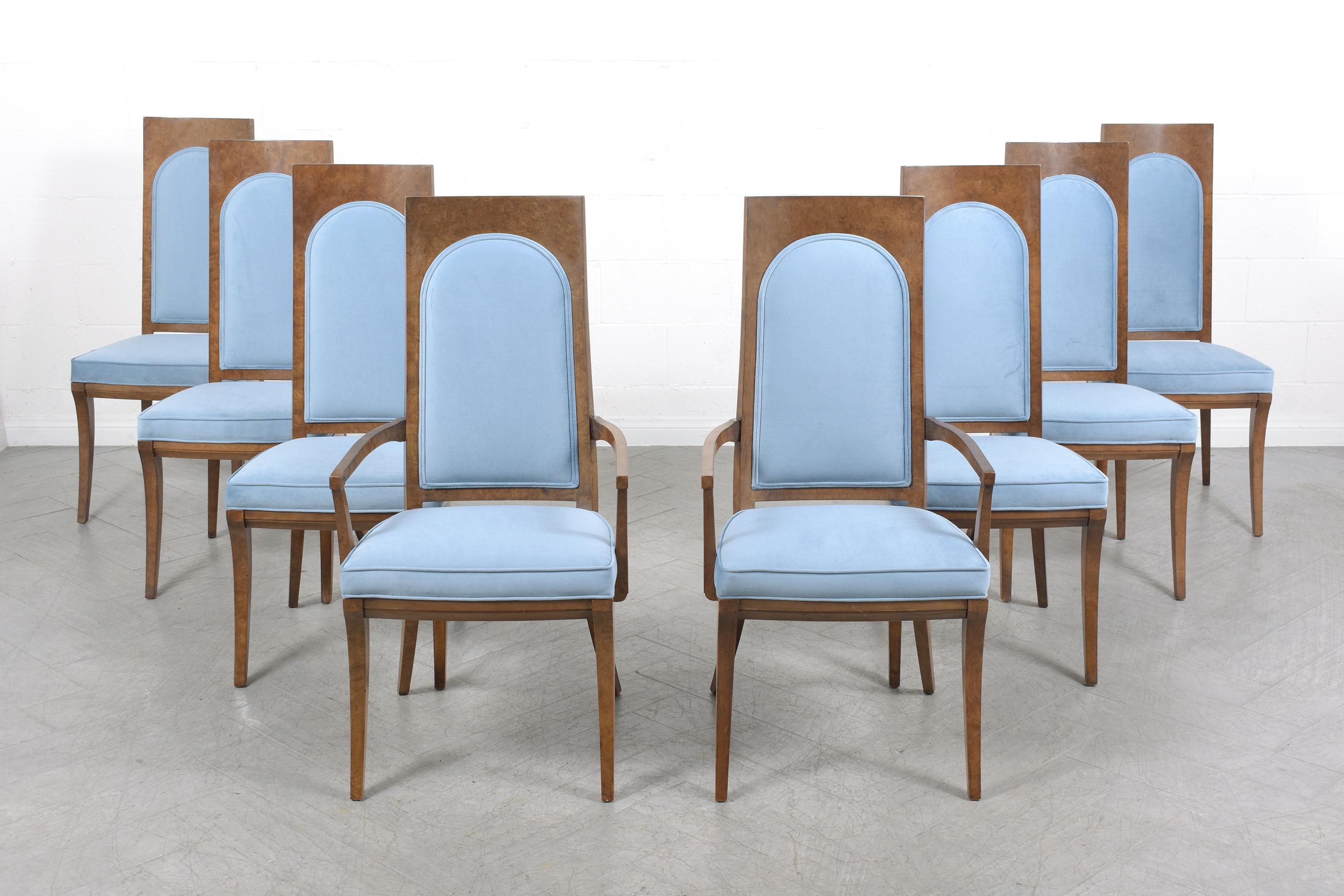 Embrace the timeless beauty of mid-century modern design with our exquisite set of eight Mastercraft dining room chairs, a true embodiment of the 1960s era. These chairs have been skillfully constructed from solid wood and have undergone a