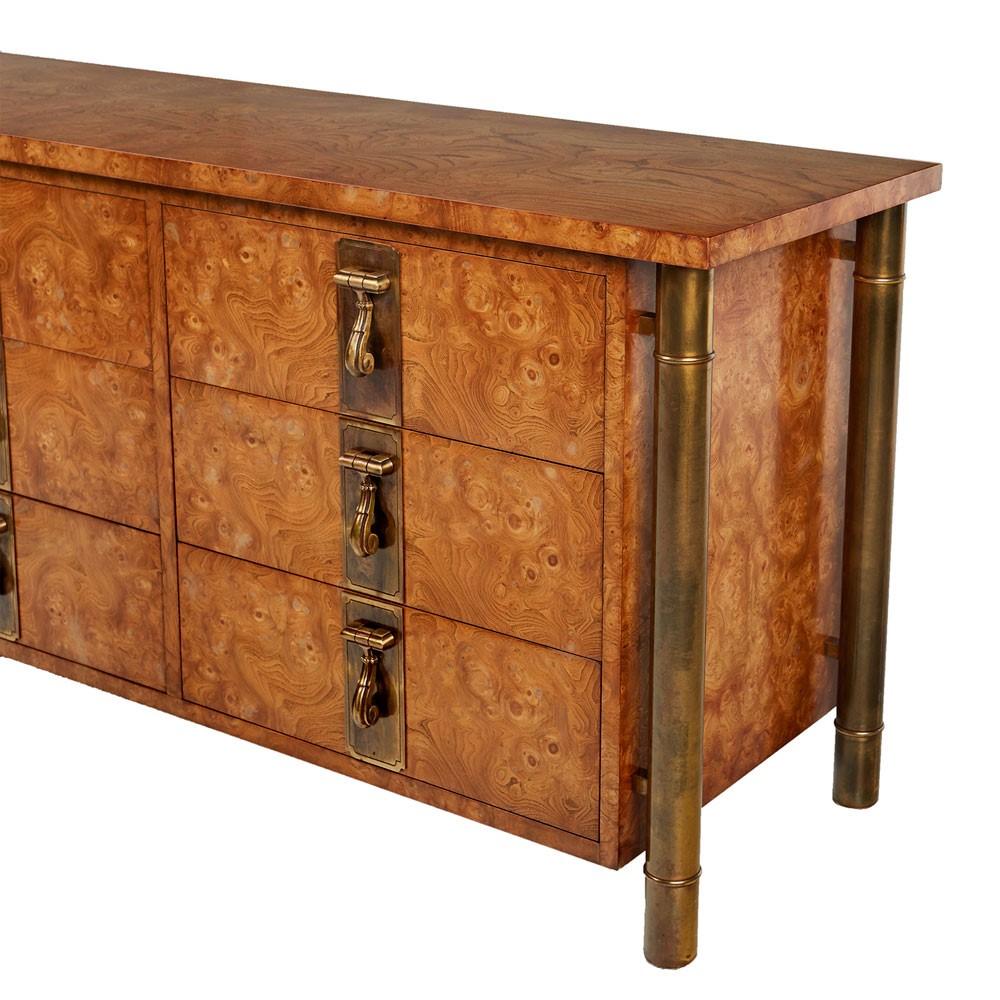 Breathtaking burl wood and brass Mastercraft dresser. Four tubular outer skeletal brass support legs create a floating effect. The columns are fashioned in the style of bamboo stalks to add an Eastern flare. Hollywood Regency and Asian Modern meld