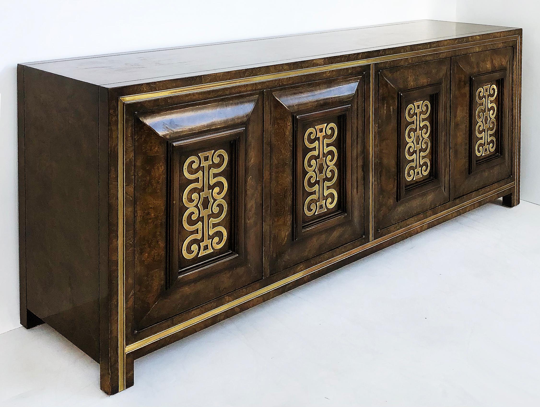 Mastercraft elm/brass credenza by William Doezema, 1970s

Offered for sale is a 1970s Mastercraft Furniture Co. Carpathian Elm and brass mounted credenza designed by William Doezema. The cabinet has four doors with touch release latches that open