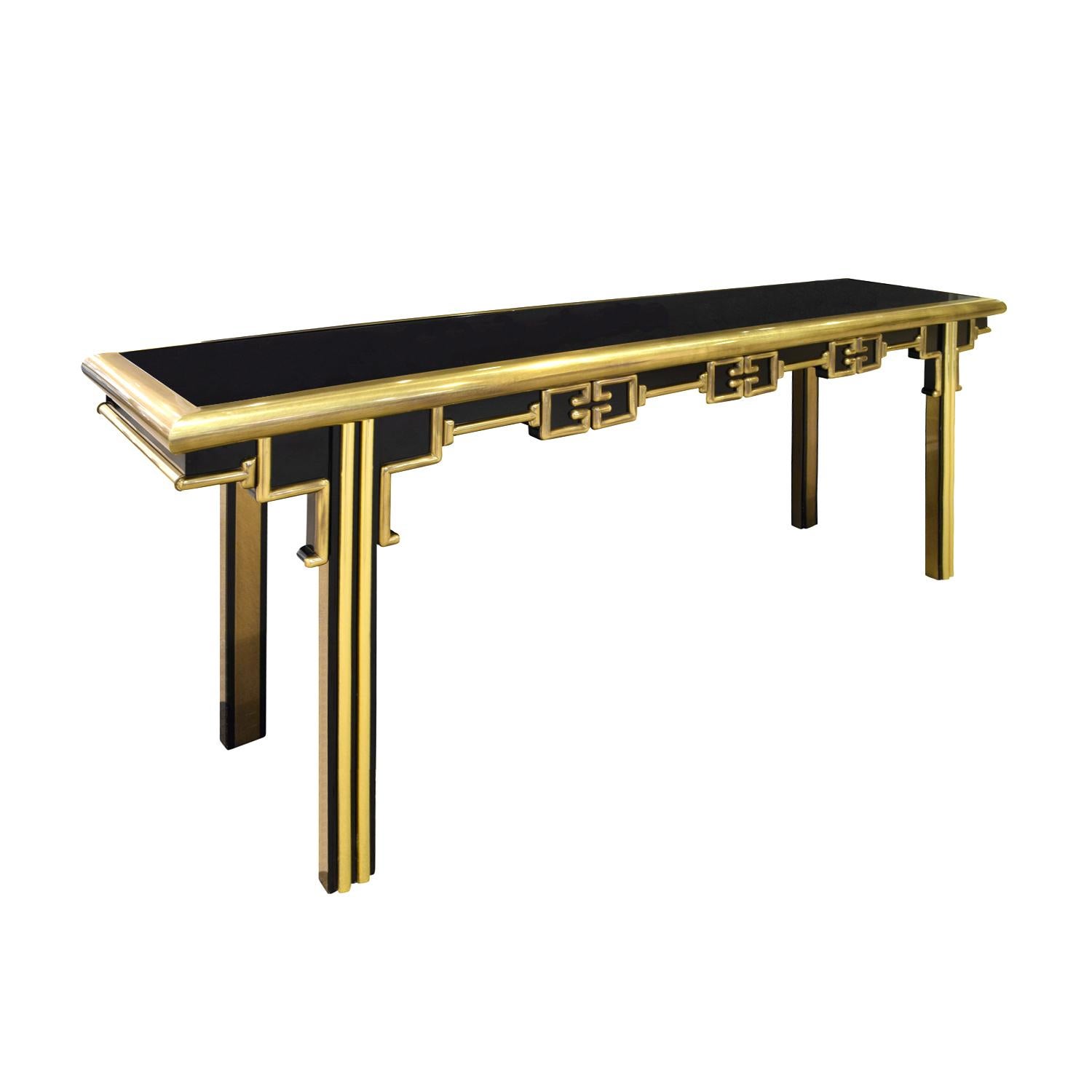 Exceptional Greek Key console table, ebonized with elaborate ornamental design in brass, by Mastercraft, American 1960s (signed on back). This table is very chic and beautifully made.