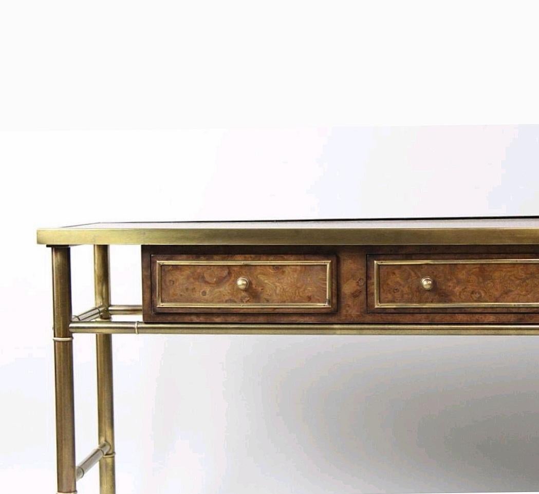 Mastercraft Model 8628 sideboard/console/sofa table designed by William Doezema circa 1970. 
Burl elm floating case of three drawers each trimmed in brass molding and solid brass pulls, set within a frame of patinated brass faux bamboo