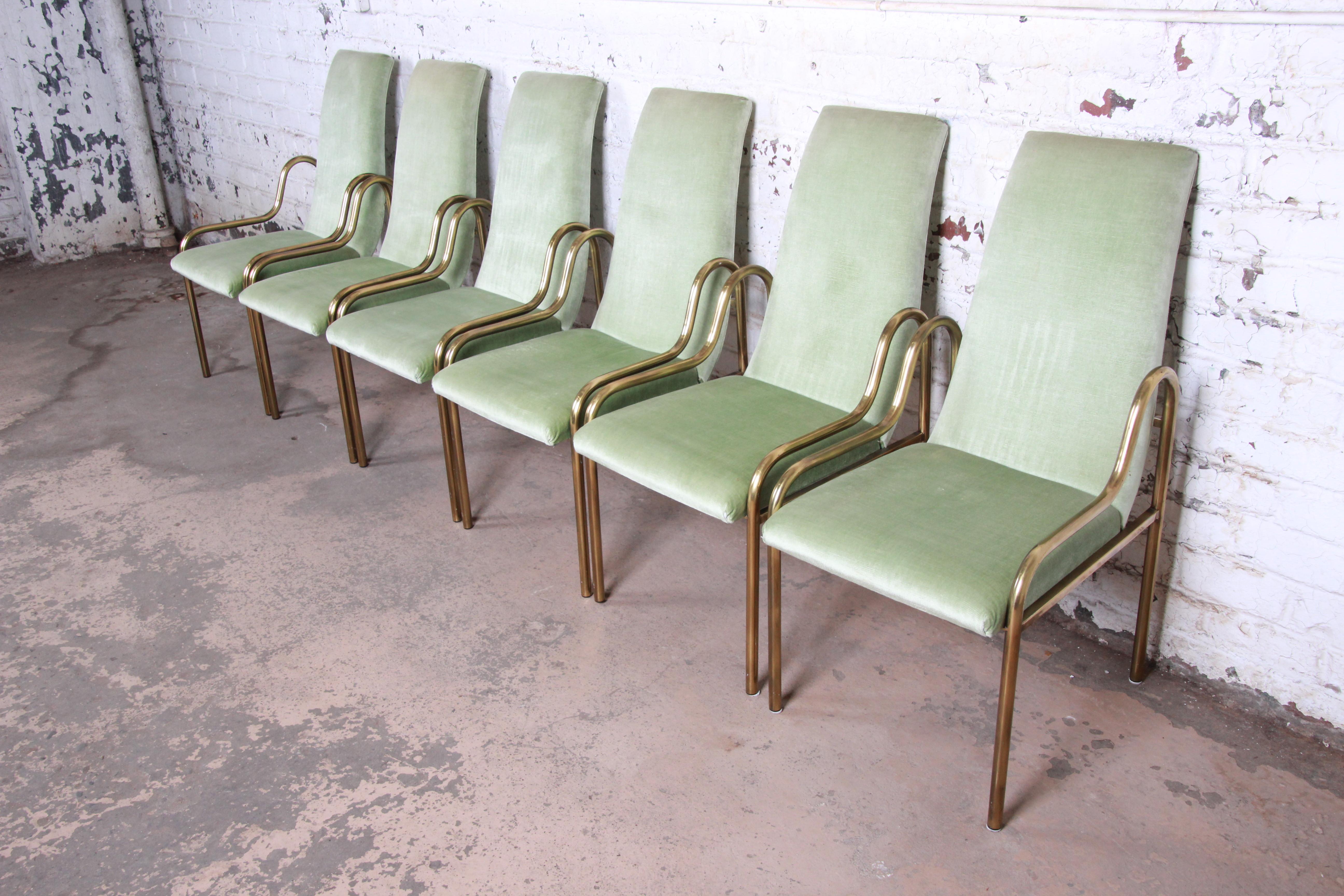 An exceptional set of six midcentury Hollywood Regency dining chairs by Mastercraft. The chairs feature sculpted brass frames with original sage green velvet upholstery. They are in very good original vintage condition.

Each chair measures