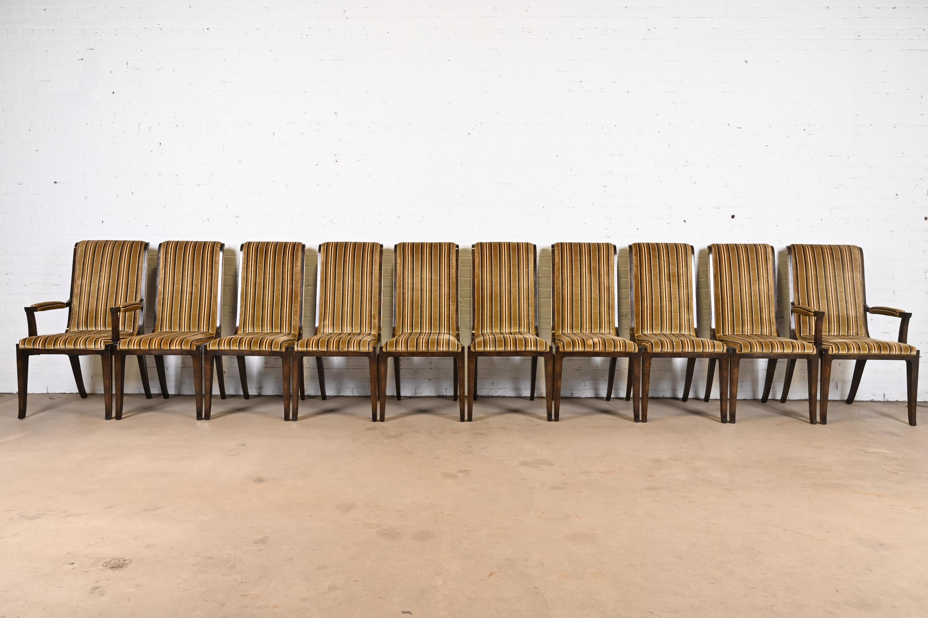 A gorgeous set of ten mid-century Hollywood Regency dining chairs

By William Doezema for Mastercraft

USA, 1970s

Beautiful burled Carpathian elm wood frames, with brass details, and velvet upholstered seats and backs in an olive green, brown