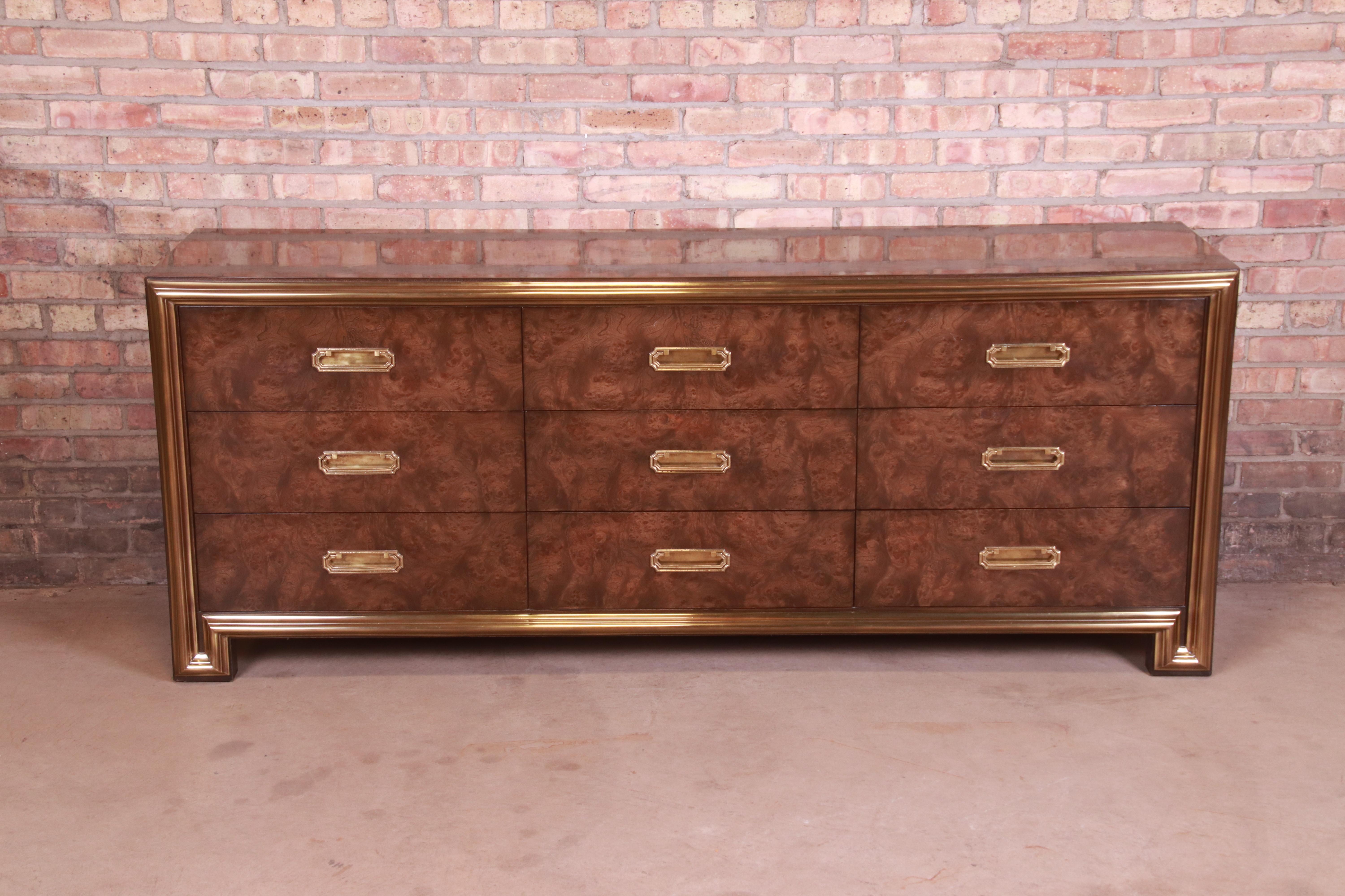 A gorgeous mid-century modern Hollywood Regency triple dresser or credenza

By Mastercraft Furniture

USA, 1970s

Burled Carpathian elm wood, with brass trim and original brass hardware.

Measures: 78