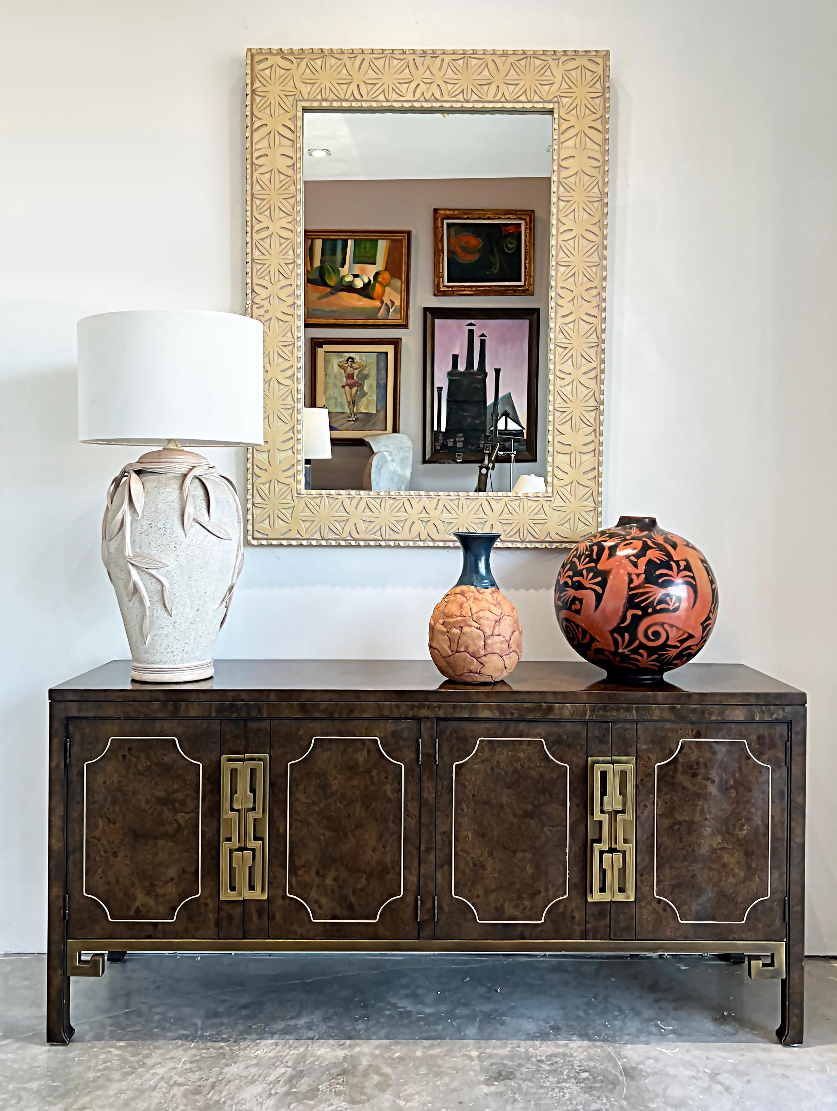 Mastercraft Hollywood Regency burl wood, Brass Credenza Sideboard

Offered for sale is a 1970s Mastercraft credenza in Carpathian elm burlwood with the original overscale brass Greek Key handles and mounted detail trim. This iconic cabinet's
