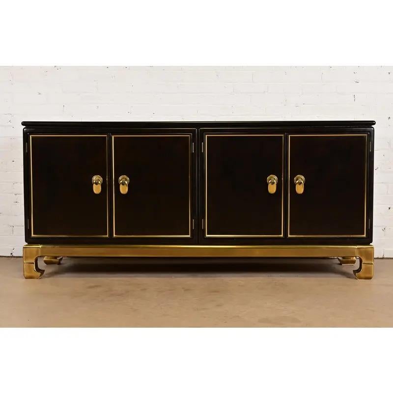 An exceptional mid-century modern Hollywood Regency Chinoiserie sideboard, credenza, or bar cabinet

By Mastercraft

USA, 1970s

Brown lacquered faux burl wood case, with original Asian-inspired brass hardware, base, and accents. Interior shelves