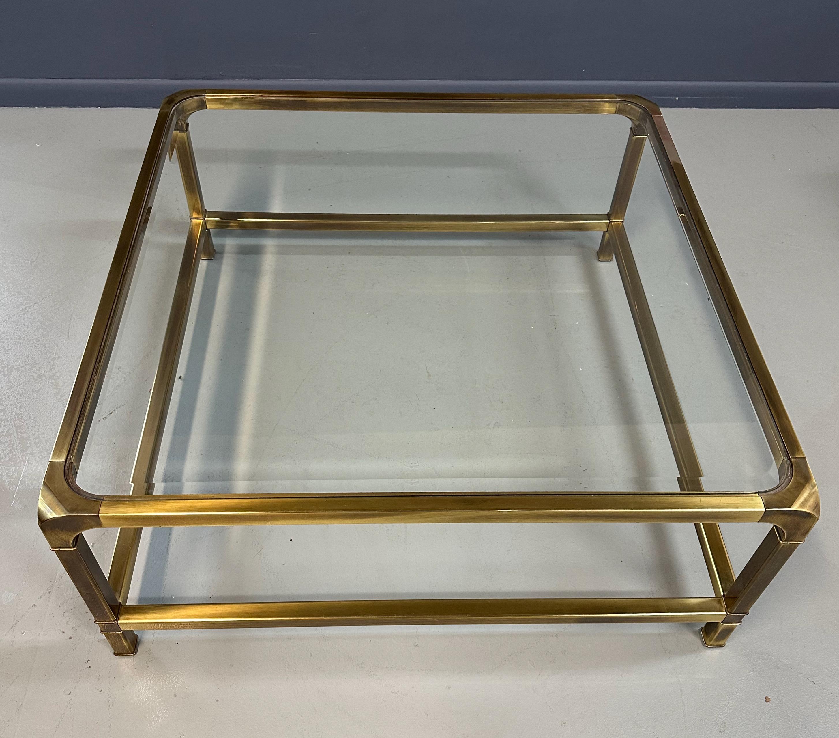 This Mastercraft Extra-Large Square Coffee Table is made with high-quality brass and glass materials, ensuring durability and a sleek, modern look. Its extra-large size makes it perfect for entertaining. Elevate your living room with this elegant