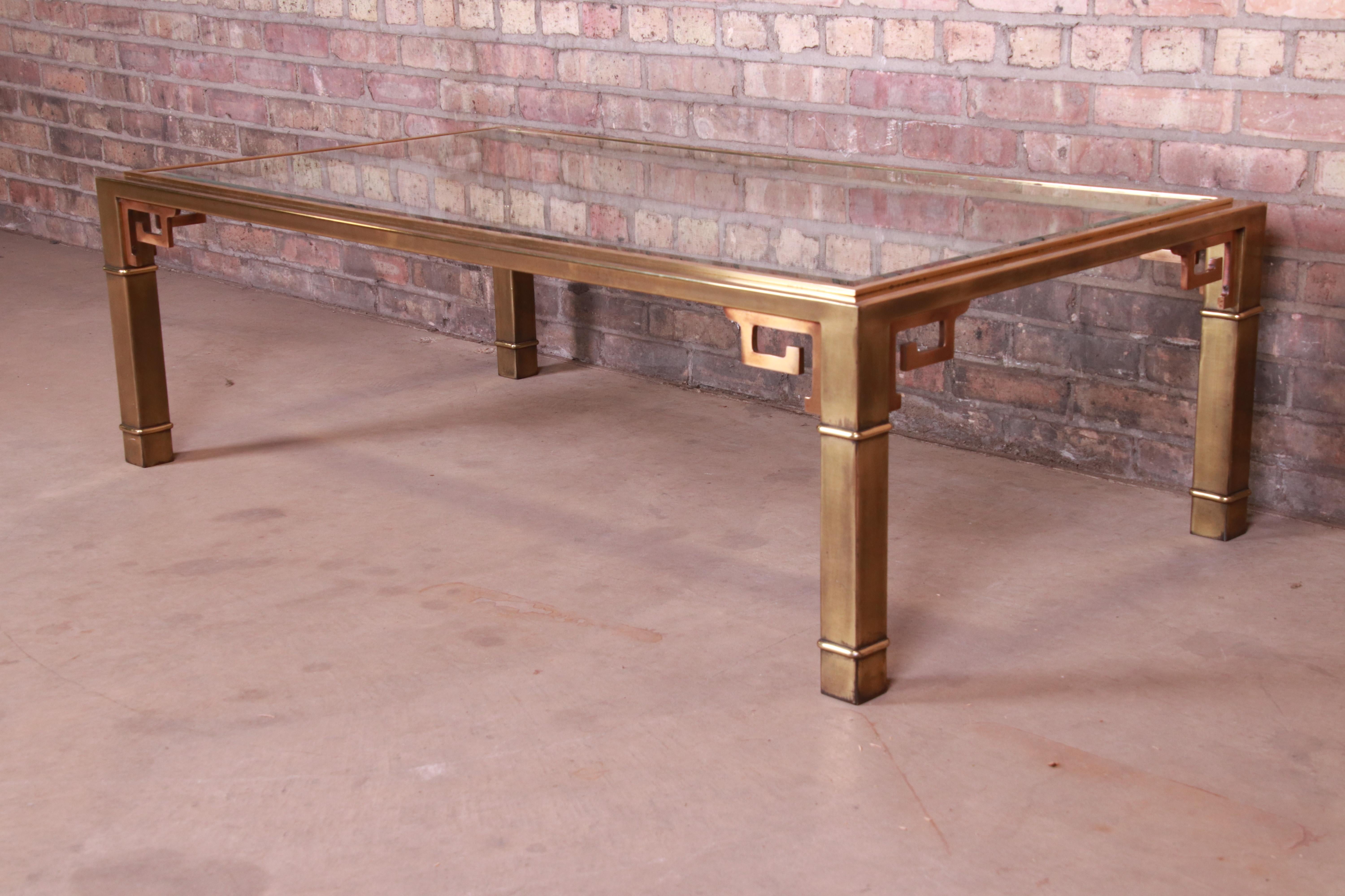 An exceptional Mid-Century Modern Hollywood Regency coffee or cocktail table

By Mastercraft

USA, 1970s

Brass frame with Greek Key design, and beveled glass top.

Measures: 55.38