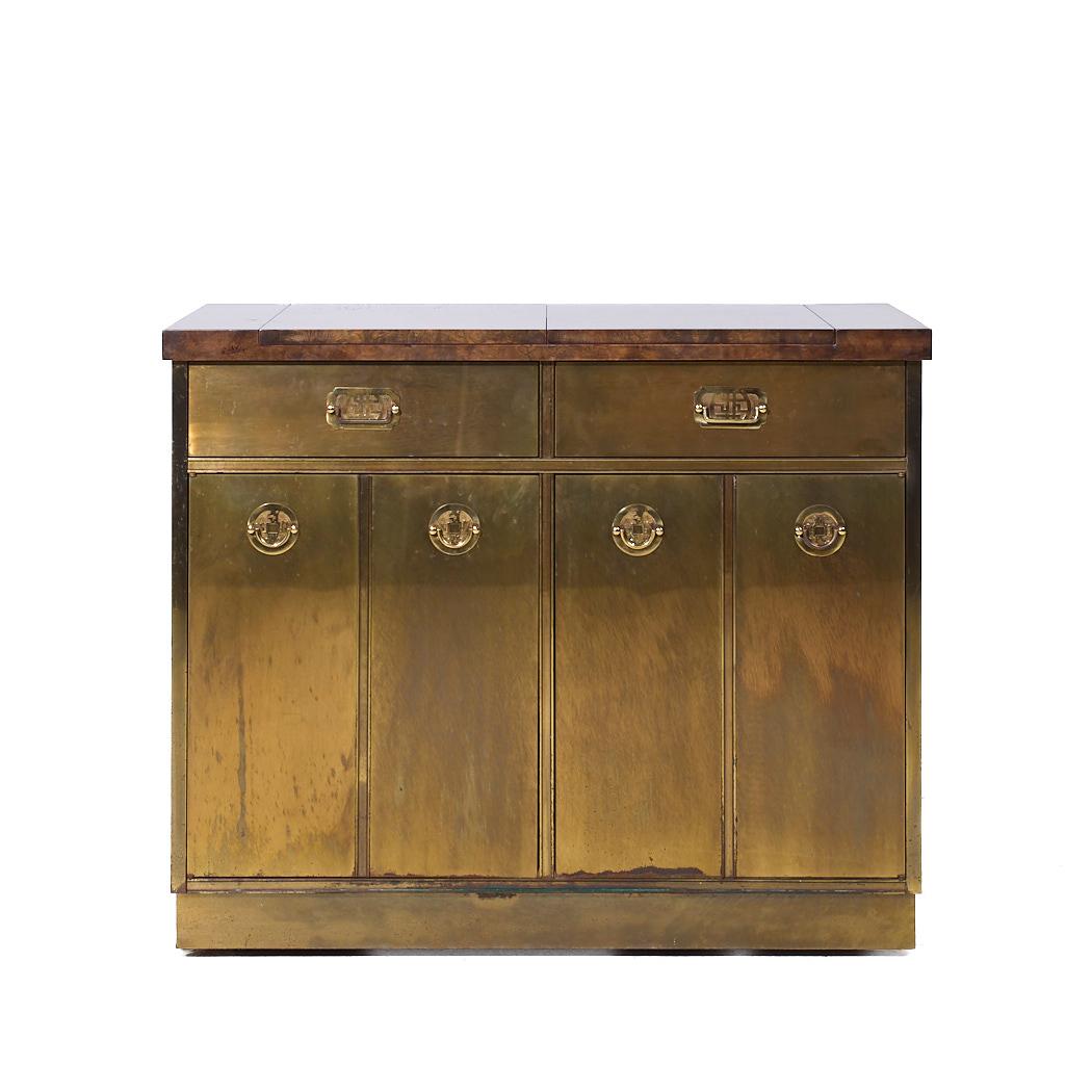 Mastercraft Mid Century Brass and Burled Elm Dry Bar Server

This dry bar measures: 40 wide x 19.25 deep x 33 high, when extended the width is 59.75 inches

We take our photos in a controlled lighting studio to show as much detail as possible. We do