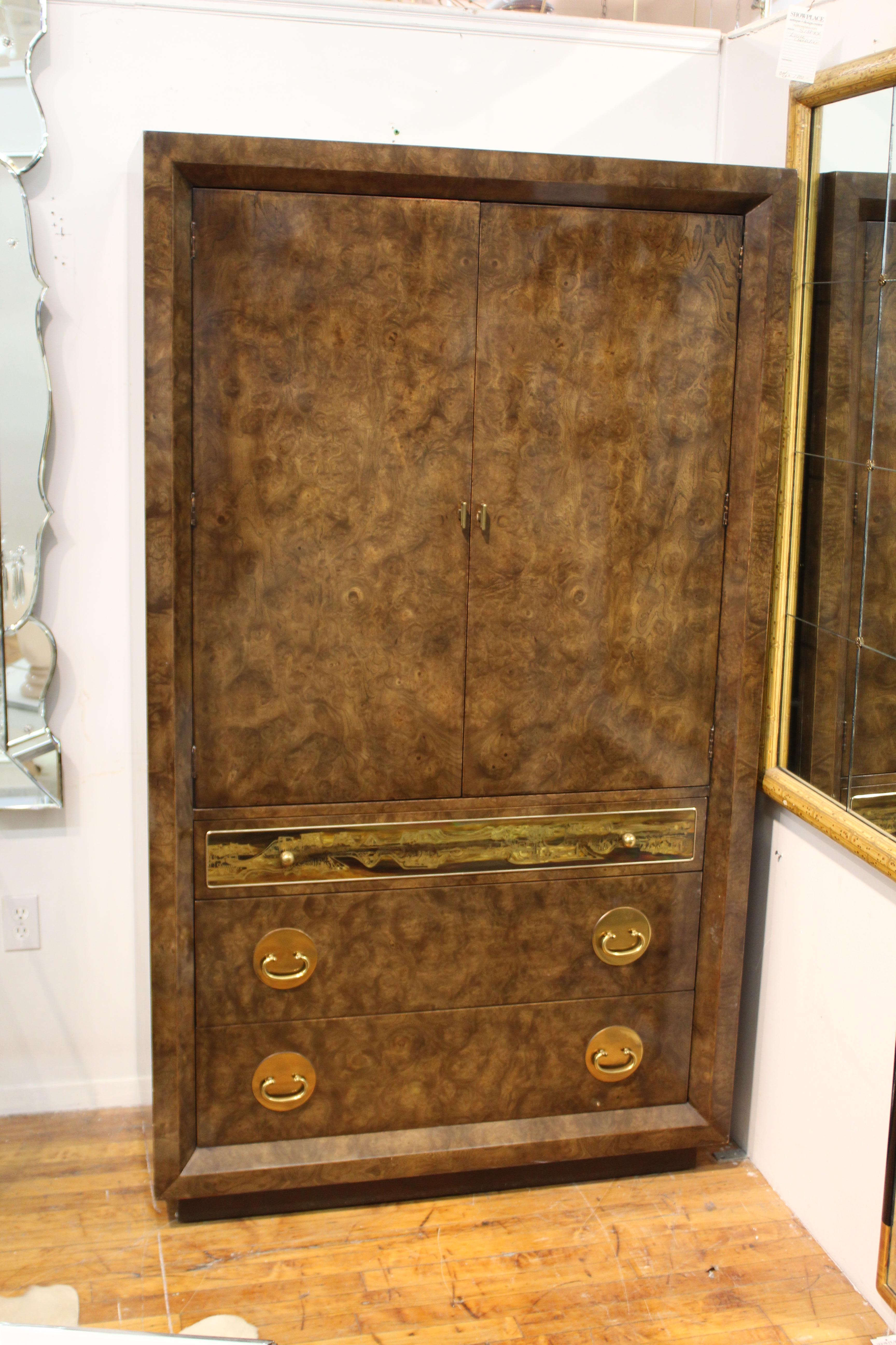 American Mid-Century Modern dresser designed by Rohne for Mastercraft in the 1970s. The piece has amboyna burl wood surfaces and acid-etched brass plate and brass hardware elements. Makers plaque on the inside of the top drawer. Three drawers on the