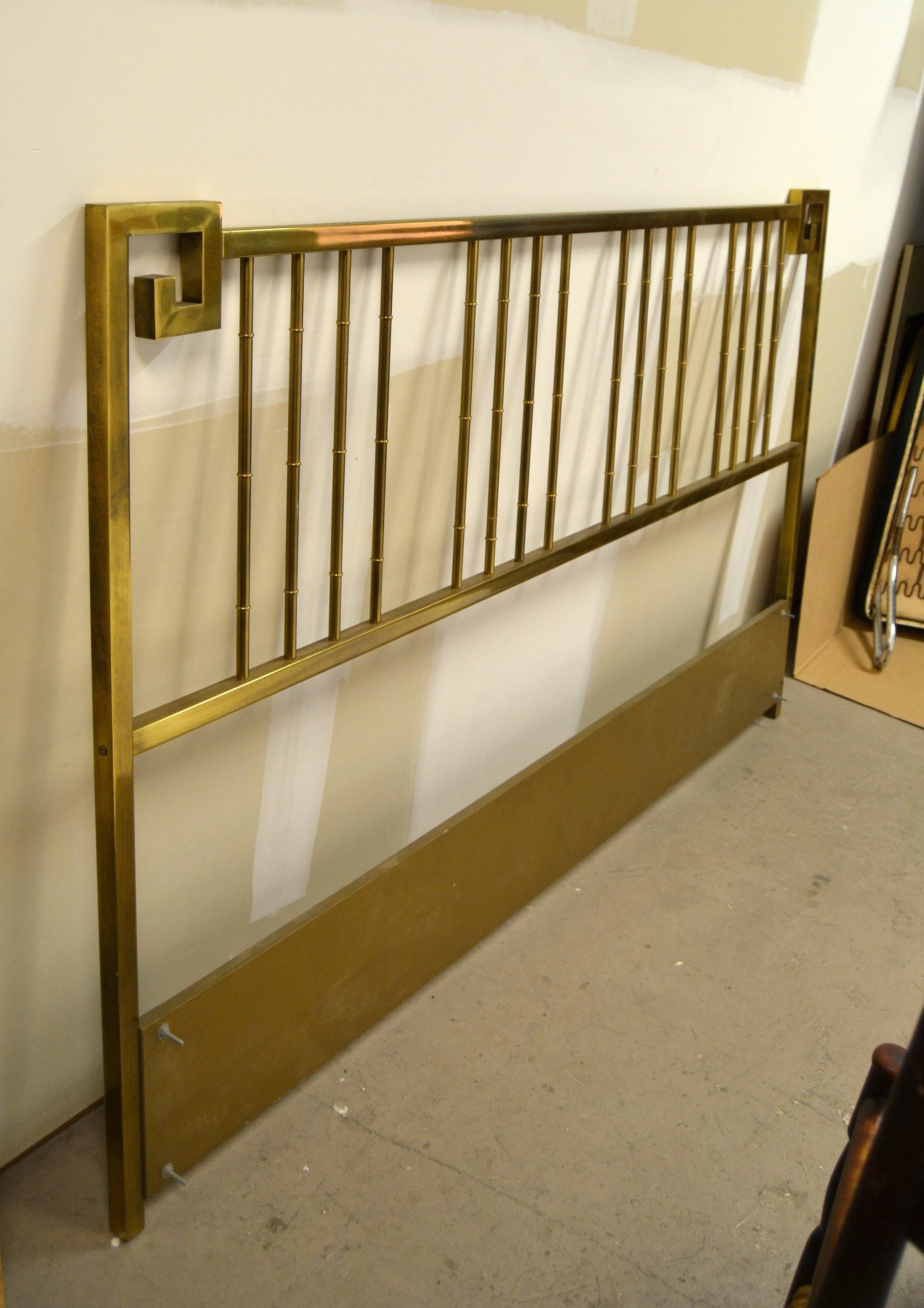 Wonderful faux bamboo brass and brass patina king size headboard executed with Greek key details.
Perfect with Mid-Century Modern decor.
Length from screw to screw is 77.25 inches.