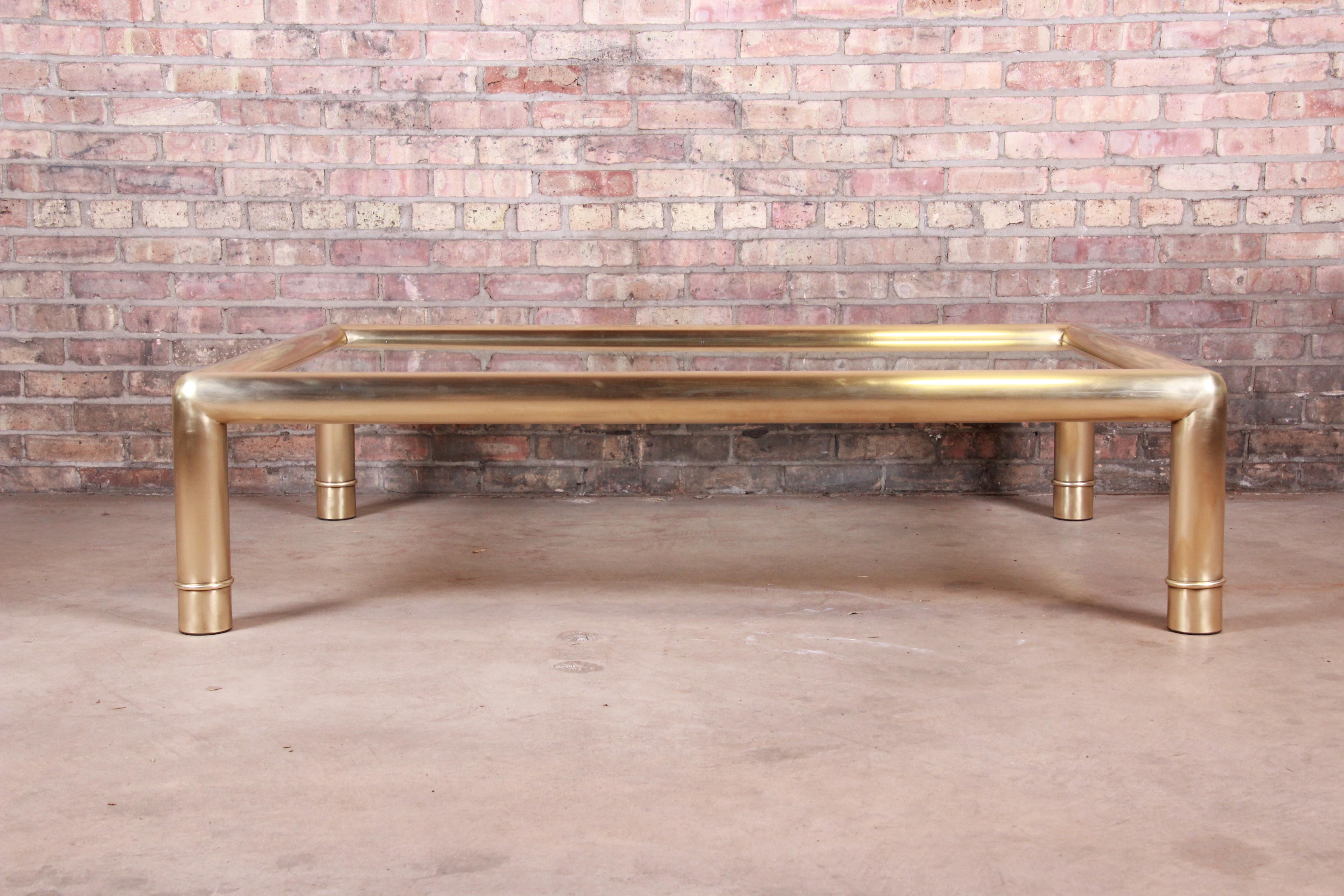 An exceptional monumental Hollywood Regency chinoiserie coffee or cocktail table.

By Mastercraft

USA, circa 1970s

Solid brass and beveled glass top.

Measures: 60