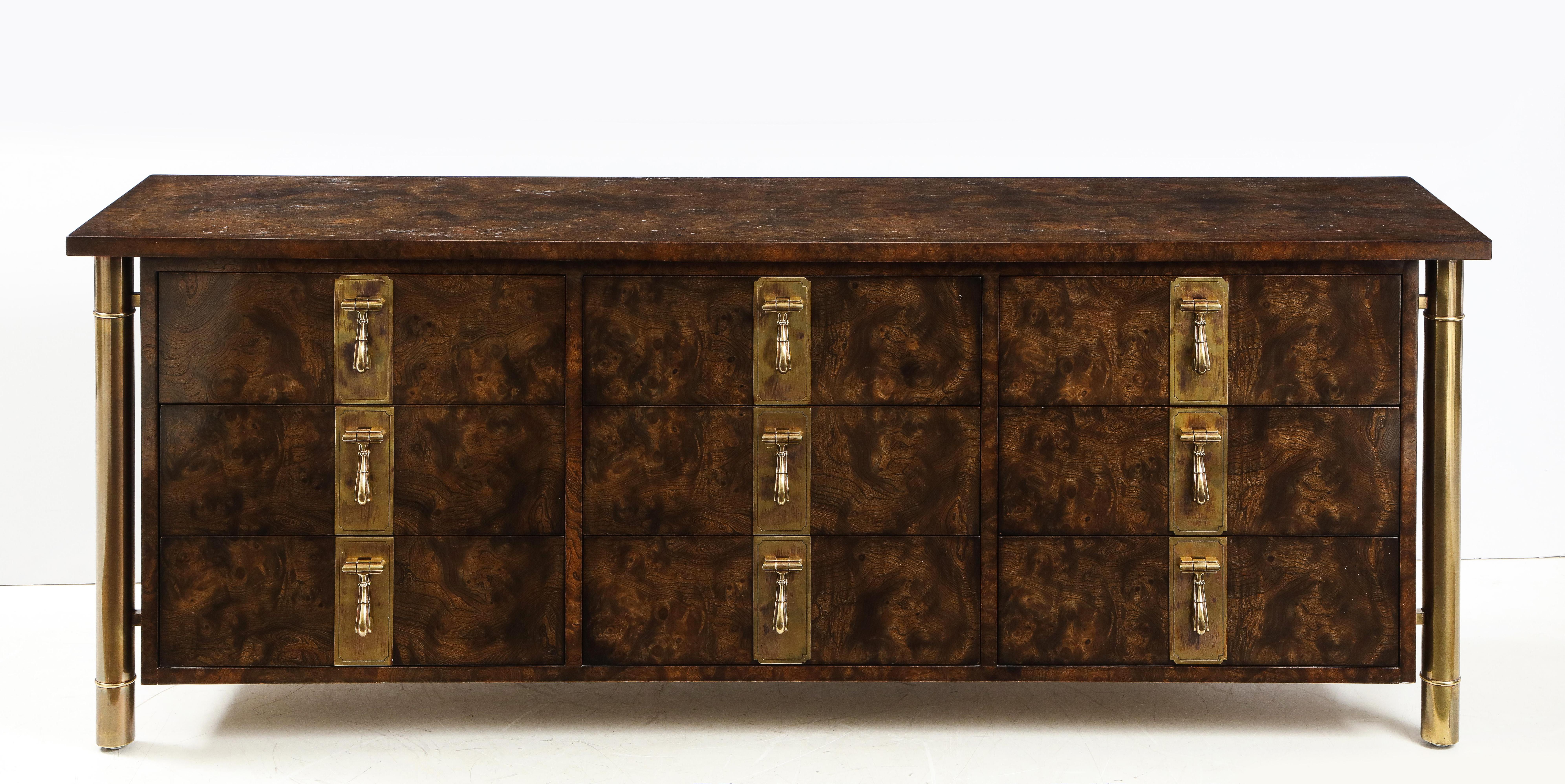 Stunning 1970s nine-drawer burl elmwood and brass hardware dresser designed by William Doezema for Mastercraft, in vintage original condition with minor wear and beautiful patina.